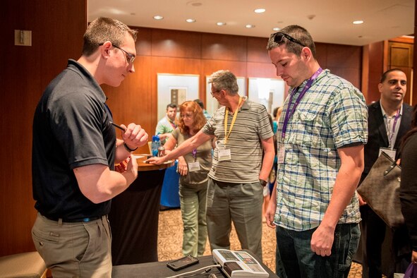 Staff Sgt. Benjamin Lowery (left), a fuels cell specialist from the 911th Air Lift Wing, Pittsburgh Air Reserve Station, Penn., uses a scale to check weight and body mass index measurements for Tech. Sgt. Jacobson Lautaro from the 482nd Fighter Wing, Homestead Air Reserve Base, Fla., during a Yellow Ribbon event in Houston March 19, 2016. Lowery uses his education and background in physical therapy to provide wellness and fitness advice to attendees. (U.S. Air Force Photo/Tech. Sgt. Benjamin Mota)
 

