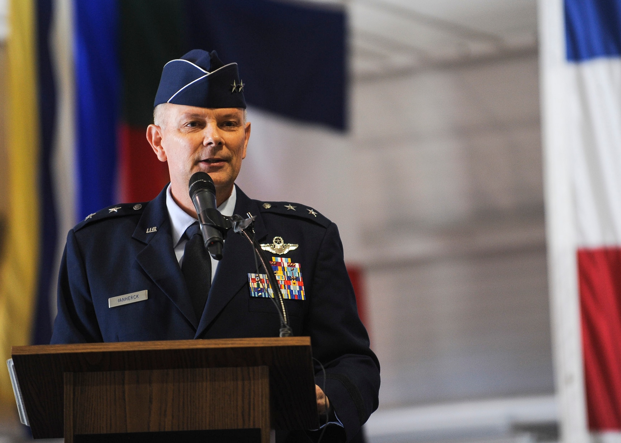 Maj. Gen. Glen VanHerck commander U.S. Air Force Warfare Center provides remarks during his change of command ceremony at the Thunderbirds hangar at Nellis Air Force Base, Nev., March 22. The USAFWC has long been at the forefront of developing innovative leaders and full spectrum capabilities through responsive, realistic, and relevant Air Force and joint testing development. (U.S. Air Force photo by Senior Airman Jake Carter)