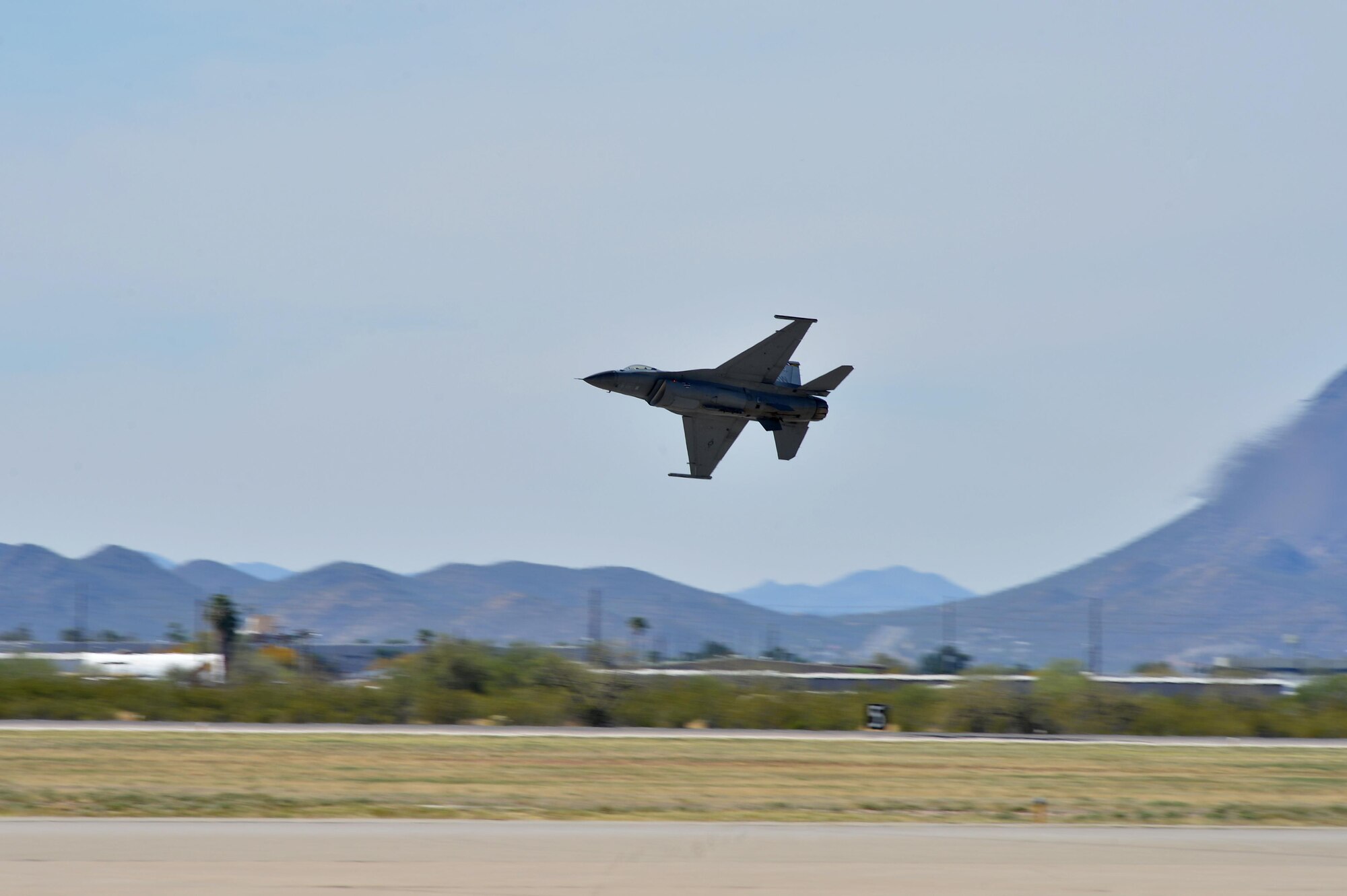 U.S. Air Force Maj. Craig “Rocket” Baker, F-16 Viper Demonstration Team pilot, takes off during an aerial demonstration at the 2016 Heritage Flight Training Course at Davis-Monthan Air Force Base, Ariz., March 4, 2016. Air Combat Command supports three demonstration teams that perform world-wide displaying the combat ready air power of U.S. Air Force. (U.S. Air Force photo by Senior Airman Diana M. Cossaboom)