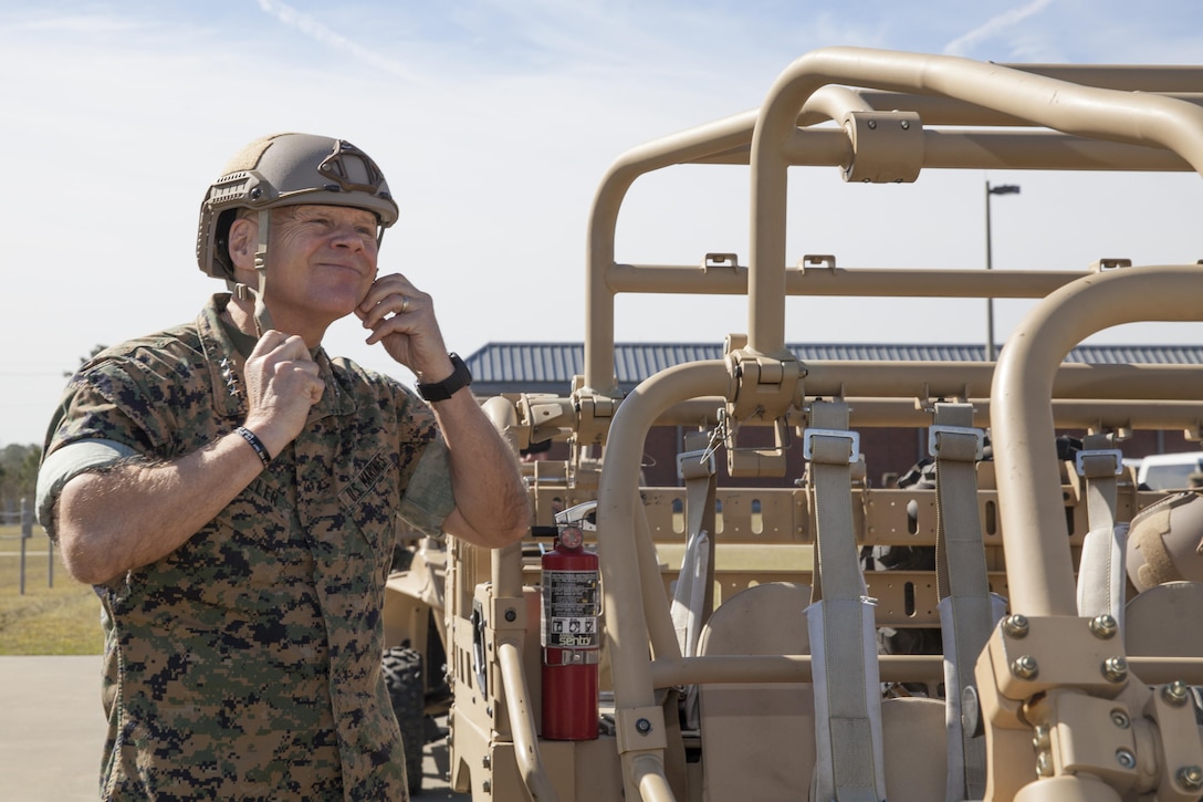 Commandant of the Marine Corps Gen. Robert B. Neller straps on a helmet before riding in a MRZR Tactical Warfighter all-terrain vehicle at Stone Bay, Marine Corps Base Camp Lejeune, N.C., March 17, 2016. Neller toured Marine Special Operations Command facilities, observed their equipment, and met with Marine Raiders. (U.S. Marine Corps photo by Cpl. Samantha K. Draughon/Released)