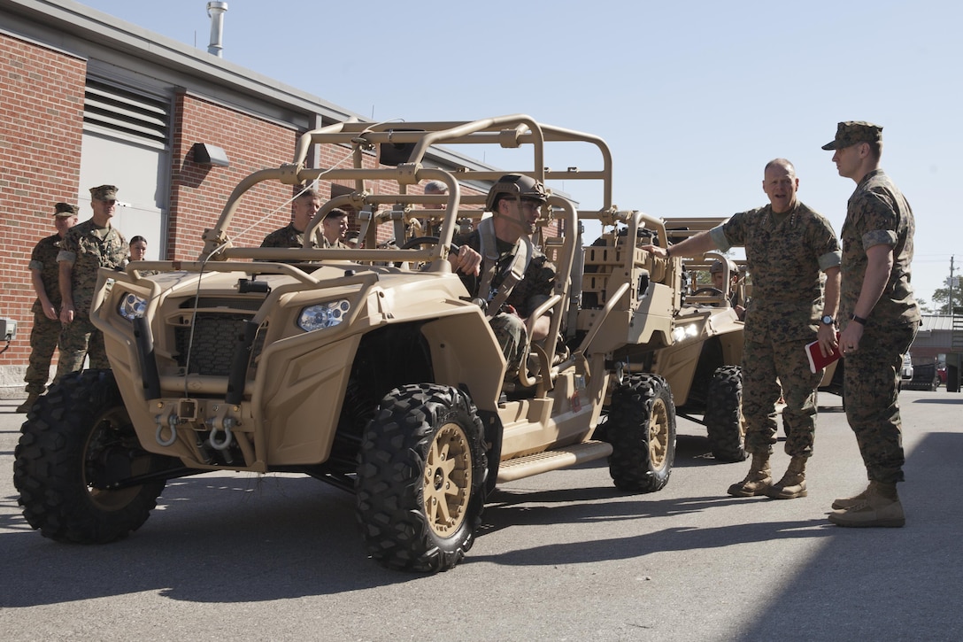Commandant of the Marine Corps Gen. Robert B. Neller discusses the MRZR Tactical Warfighter all-terrain vehicle at Stone Bay, Marine Corps Base Camp Lejeune, N.C., March 17, 2016. Neller toured Marine Special Operations Command facilities, observed their equipment, and met with Marine Raiders. (U.S. Marine Corps photo by Cpl. Samantha K. Draughon/Released)