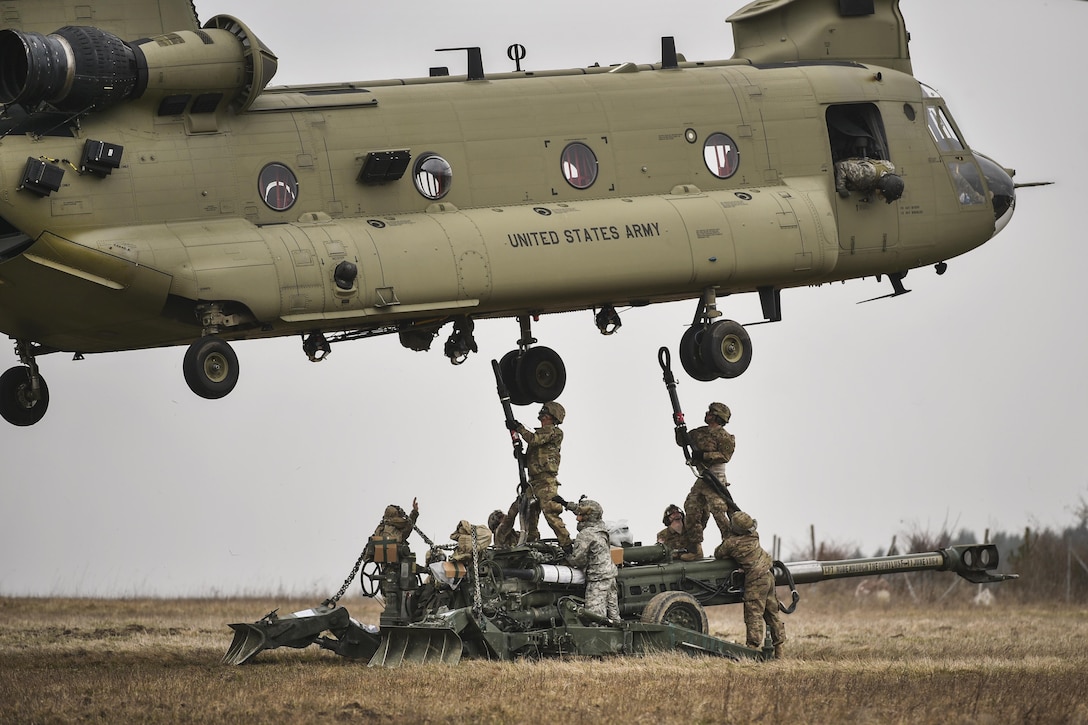 Soldiers conduct slingload training with M777 howitzers during Artillery Systems Cooperation Activities at the 7th Army Joint Multinational Training Command's Grafenwoehr Training Area in Germany, March 21, 2016. The soldiers are assigned to Archer Battery, Field Artillery Squadron, 2nd Cavalry Regiment. Army photo by Gertrud Zach