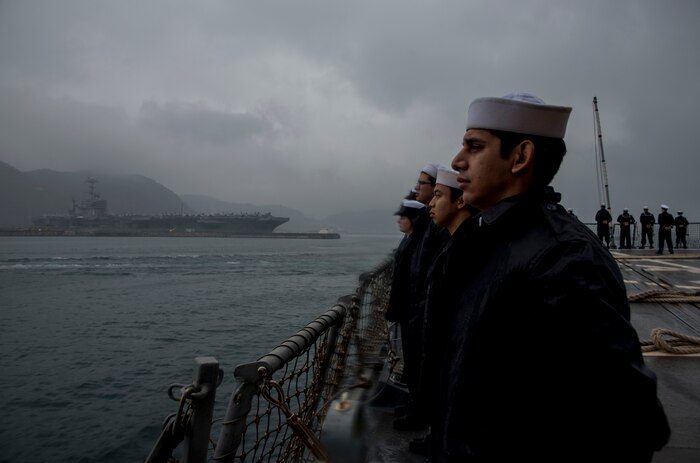 160318-N-MJ645-112 BUSAN, Republic of Korea (March 18, 2016) Sailors aboard the guided-missile destroyer USS Chung-Hoon (DDG 93) man the rails as the ship departs Busan following a port visit. Providing a ready force supporting security and stability in the Indo-Asia-Pacific, Chung-Hoon is operating as part of the John C. Stennis Strike Group and Great Green Fleet on a regularly scheduled 7th Fleet deployment. (U.S. Navy photo by Mass Communication Specialist 2nd Class Marcus L. Stanley/Released)
