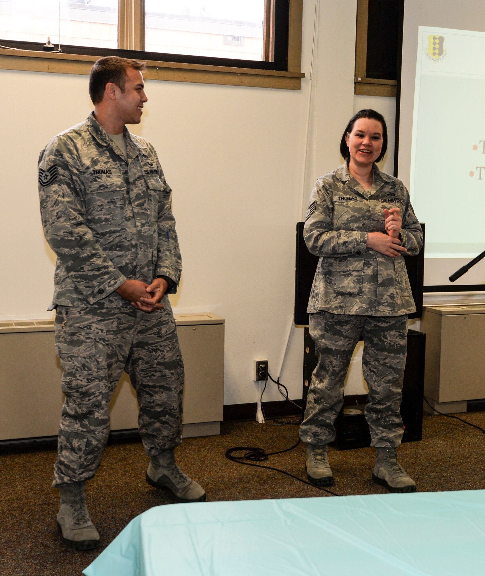 Tech. Sgts. Brian and Leah Thomas, 28th Force Support Squadron Airman and Family Readiness Center readiness NCO, and 28th Operations Support Squadron unit deployment manager, respectively, speak about their experience as foster parents during the “Why Not You?” campaign at Ellsworth Air Force Base, S.D., March 15, 2016. Many representatives spoke about the adoption and fostering programs their agencies offers. (U.S. Air Force photo by Airman 1st Class Sadie Colbert/Released)
