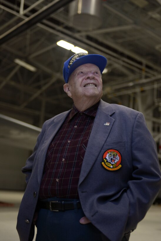 Retired Col. Chuck Childs, former Army Air Corps pilot, is presented with a 37th Bomb Squadron patch at Ellsworth Air Force Base, S.D., March 18, 2016. Childs was a part of the 15th Army Air Force out of Amendola, Italy, and flew 37 missions, earning the Distinguished Flying Cross twice, as well as the Bronze Star. (U.S. Air Force photo by Airman Donald Knechtel/Released)