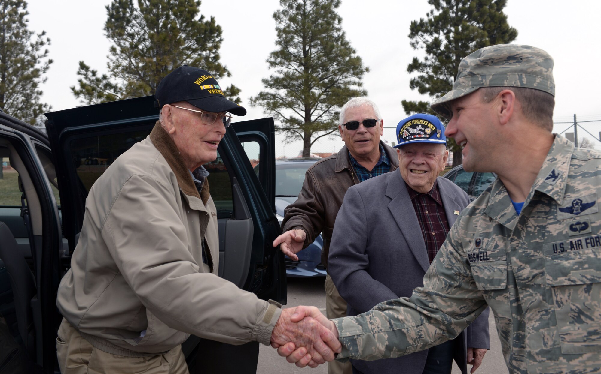 Retired Col. Hilary Cole, former Army Air Corps pilot, is greeted by Col. Gentry Boswell, 28th Bomb Wing commander, at Ellsworth Air Force Base, S.D., March 18, 2016. In his career, Cole flew over 65 missions in Europe as well as another nine with the Royal Air Force, earning 15 air medals in the process. (U.S. Air Force photo by Airman Donald Knechtel/Released)