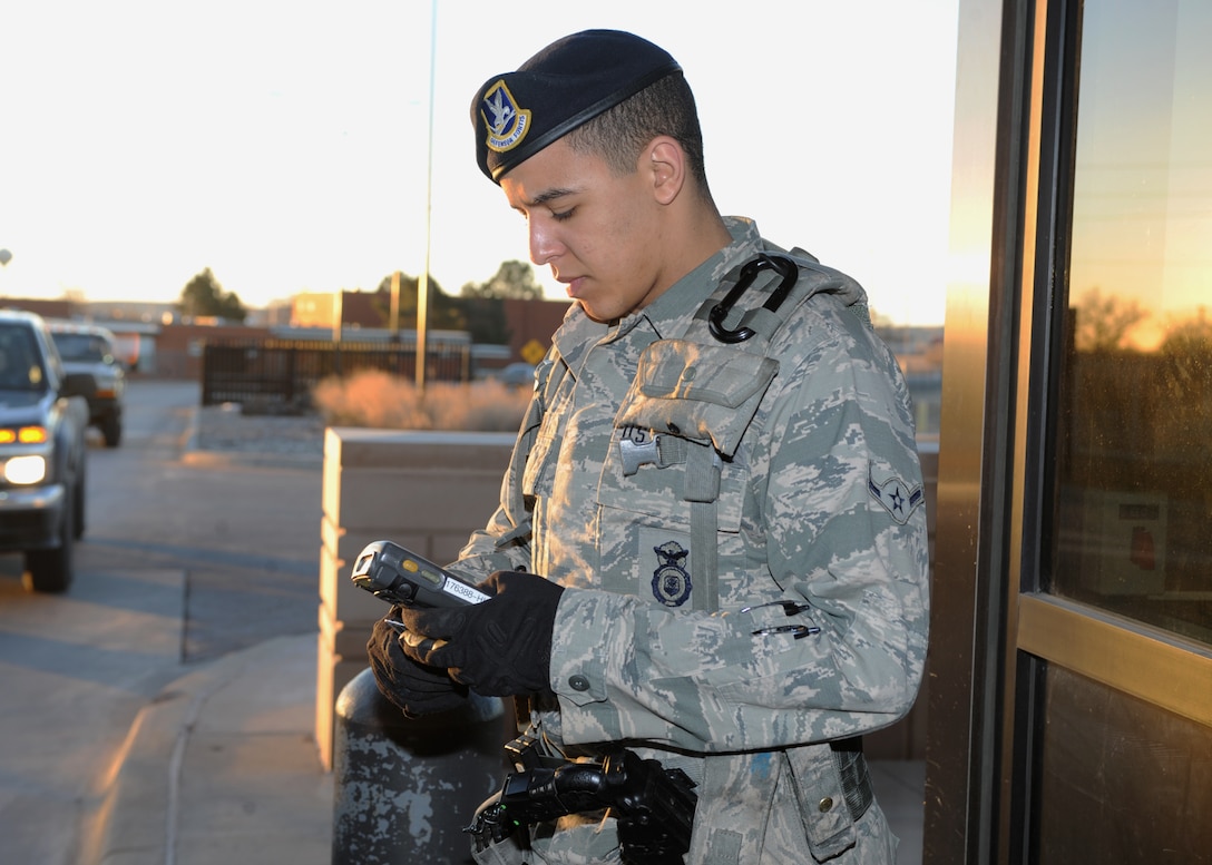 Airman Brandon Hickman, 28th Security Forces Squadron response force member, verifies ID cards at the gates of Ellsworth Air Force Base, S.D., Feb. 10, 2016. Airmen of the 28th SFS use the Defense Biometric Identification System to determine if an individual is authorized entry to the base. (U.S. Air Force photo by Airman 1st Class Denise M. Nevins/Released)