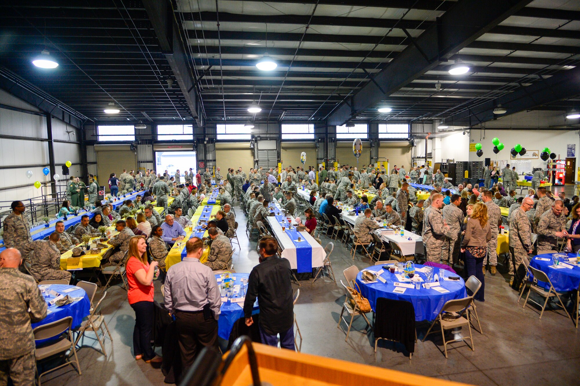 Team Dover Airmen attend the 2015 Maintenance Professional of the Year ceremony March 16, 2016, at the 436th Aerial Port on Dover Air Force Base, Del. Each squadron within the 436th and 512th Maintenance Groups had their own section of seating to cheer as loudly as possible as Airmen from their squadrons won awards. (U.S. Air Force photo/Senior Airman William Johnson)