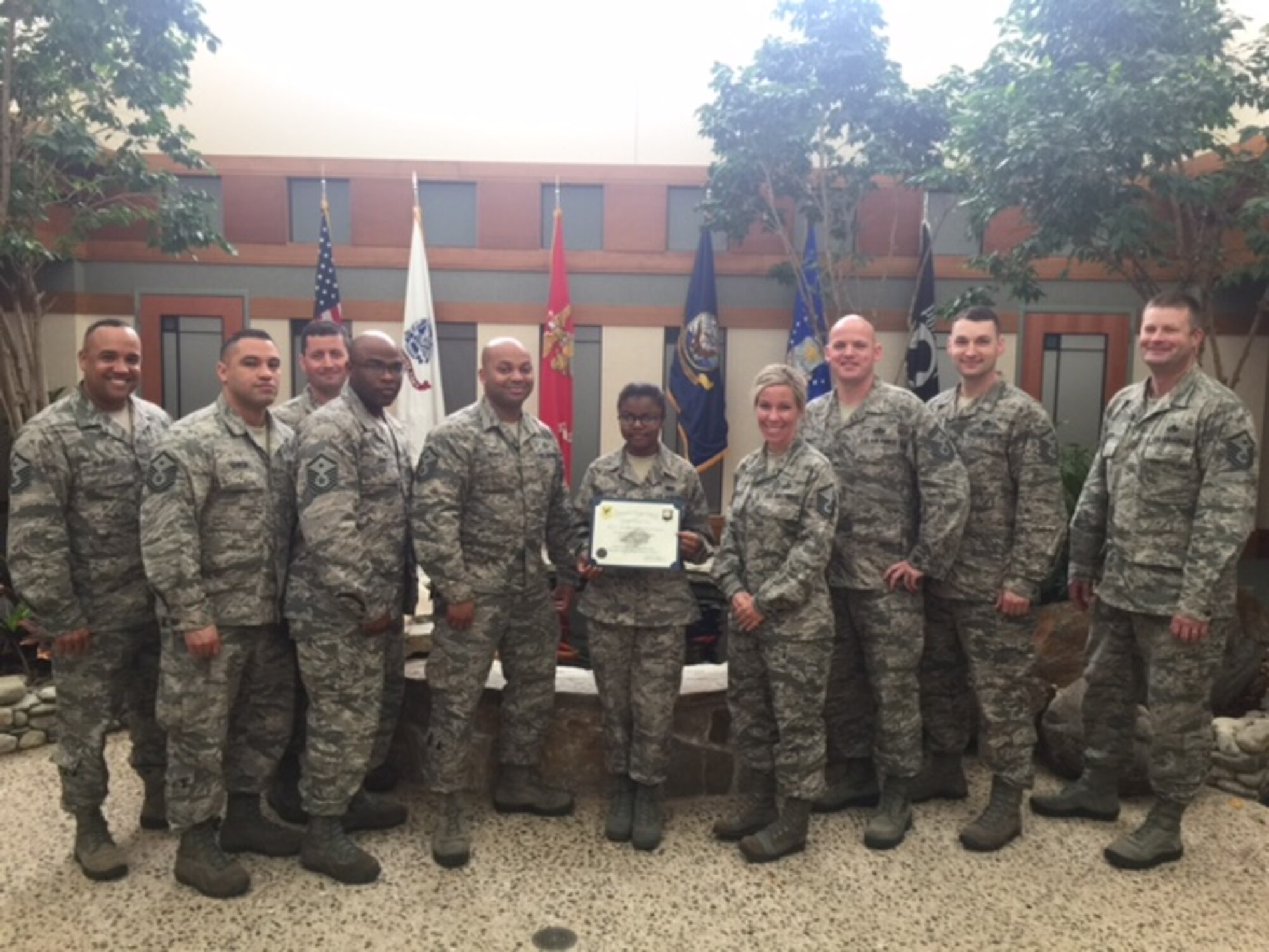 Airman 1st Class Kenisha Robertson, 436th Force Support Squadron food service technician, is presented the Dover First Sergeant Council’s Diamond Sharp Award March 17, 2016, at Dover Air Force Base, Del. Robertson, a native of Guyana, enlisted in the Air Force by way of Colorado Springs, Colo. and has earned her U.S. citizenship. She is currently deployed to the Air Force Mortuary Affairs Operations, excelling as a Dignified Transfer Team member ensuring that our fallen heroes receive the dignity, honor and respect they deserve. (Courtesy photo)