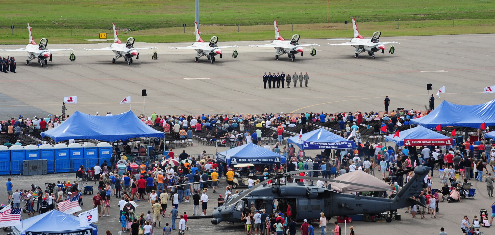 Spectators watch as members of Team MacDill are honored for their distinguished accomplishments by the Thunderbirds during Tampa Bay AirFest 2016 at MacDill Air Force Base, Fla., March 20, 2016. MacDill was host to aerial demonstrations, static displays and featured the Air Force Thunderbirds, giving the Tampa Bay community the opportunity to witness firsthand the capabilities of the armed forces. (U.S. Air Force photo by Senior Airman Jenay Randolph)