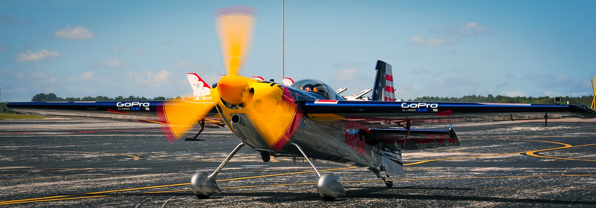 Kirby Chambliss and the Red Bull Air Force taxi down the flightline to perform an aerial demonstration during Tampa Bay AirFest 2016 at MacDill Air Force Base, Fla., March 20, 2016. MacDill was host to spectacular aerial demonstrations, static displays and featured the U.S. Air Force Air Demonstration Squadron Thunderbirds, giving the Tampa Bay community the opportunity to witness firsthand the capabilities of the armed forces. (U.S. Air Force photo by Senior Airman Jenay Randolph)