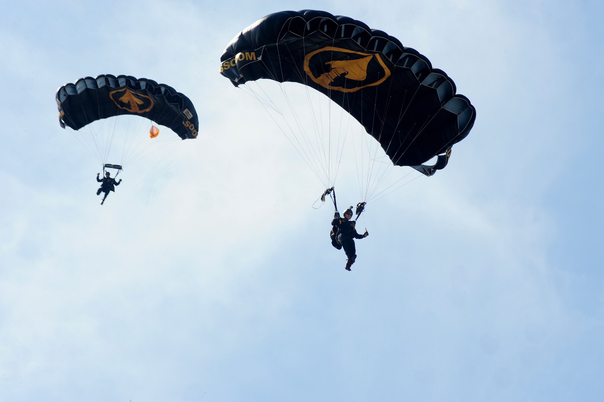 The United States Special Operations Command Para-Commandos free fall during the Tampa Bay AirFest 2016 at MacDill Air Force Base, Fla., March 20, 2016. The team members volunteer to serve as Para-Commandos as an additional duty, spending their weekends honing their skills and performing for the U.S. public. (U.S. Air Force photo by Senior Airman Jenay Randolph)  