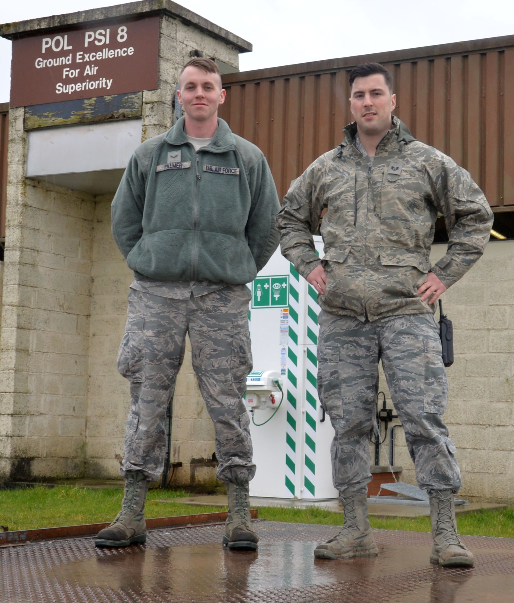 U.S. Air Force Airman 1st Class George Palmer, left, 100th Logistics Readiness Squadron mobile distribution operator, and U.S. Air Force Staff Sgt. Dakota Ferris, 100th LRS NCO in charge of fixed facilities, pose for a photograph March 9, 2016, on RAF Mildenhall, England. For six months many of the flight’s Airmen were deployed and one of their main fuel systems was being refurbished.  The remaining in-garrison team managed daily operations by taking on extra duties and working extended shifts to ensure round-the-clock fuel support was available. (U.S. Air Force photo by Gina Randall/Released)