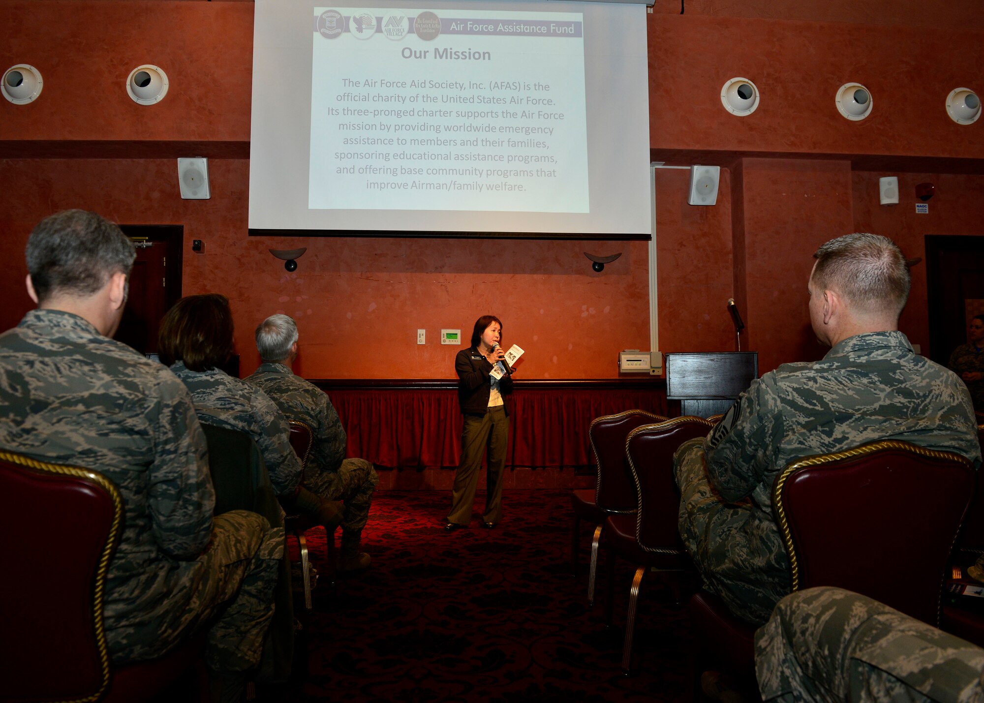 Toni Geronimo, 31st Force Support Squadron community readiness consultant, speaks to attendees at the Air Force Assistance Fund kick-off breakfast, March 18, 2016, at Aviano Air Base, Italy. The AFAF campaign is held from March 21 to April 29, 2016, and helps Airmen and their families in need of financial help. (U.S. Air Force photo by Airman 1st Class Cary Smith/Released)
