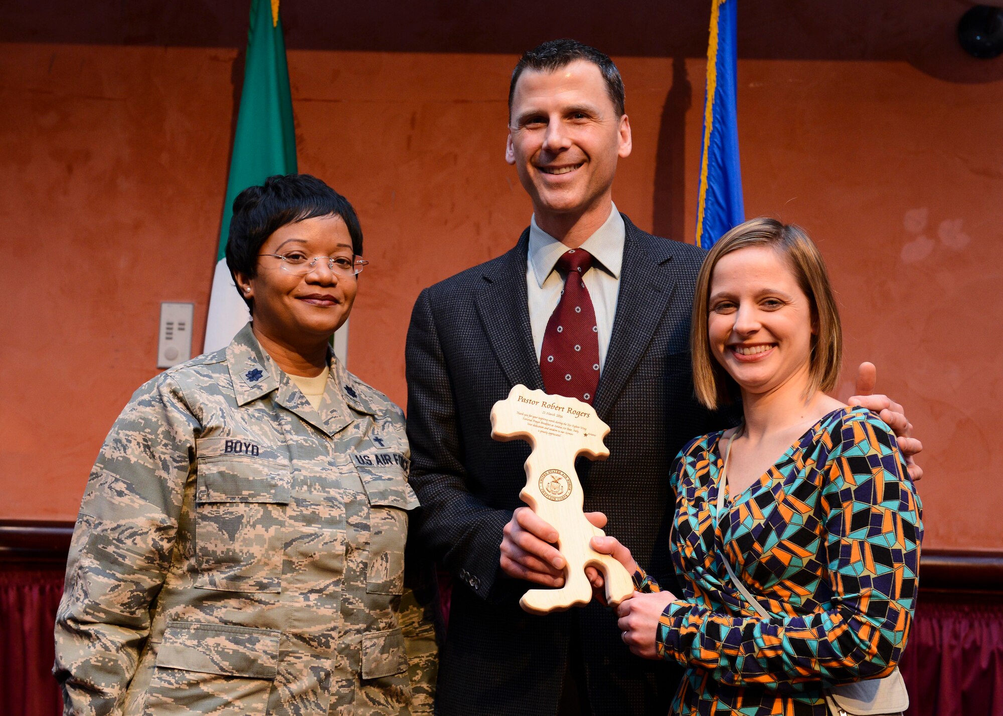 From left, Lt. Col. Donnette Boyd, 31st Fighter Wing chaplain, Robert Rogers, Mighty in the Land Ministry founder, and his wife, Inga Rogers, pose during a National Prayer Breakfast observance, March 21, 2016. Approximately 200 Team Aviano members attended the observance, which encouraged them to practice fellowship and resiliency. (U.S. Air Force photo by Senior Airman Austin Harvill/Released)