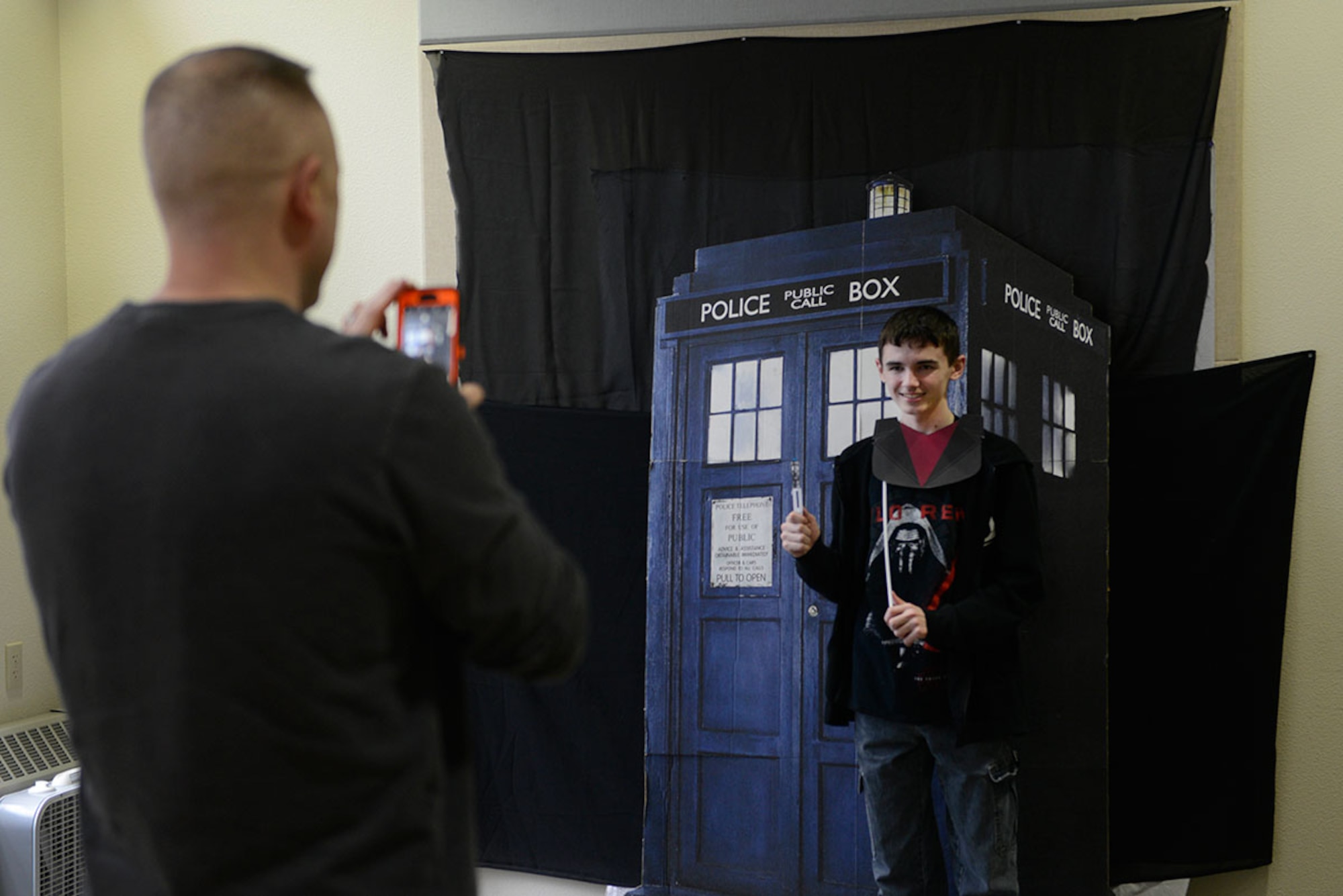 Kaleb Johnson, 13, gets his photo taken during the Dr. Who Wibbly Wobbly Timey Wimey teen program at the Joint Base Elmendorf- Richardson Library, March 16, 2016. Teens discussed their favorite Dr. Who characters and episodes during the event. Johnson is the son of Tech. Sgt. Kristopher Kreis, with the 673d Logistics Readiness Squadron. (U.S Air Force photo by Airman Valerie Monroy)