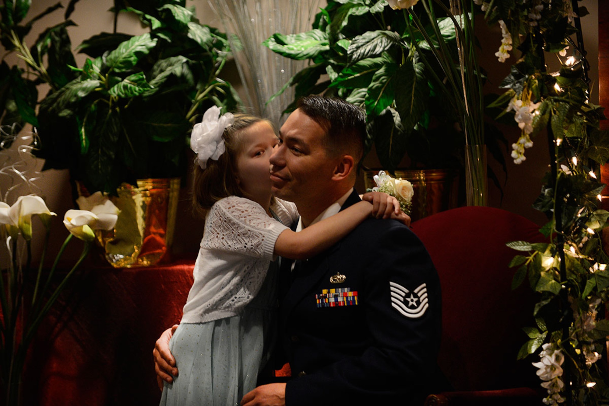 Tech. Sgt. Viktor Morgan, 3rd Aircraft Maintenance Squadron, and his daughter Bianca Morgan, 7, attend the Father/Daughter and Mother/Son Dance at the Arctic Warrior Events Center March 18, 2016. (U.S. Air Force photo by Airman Valerie Monroy)