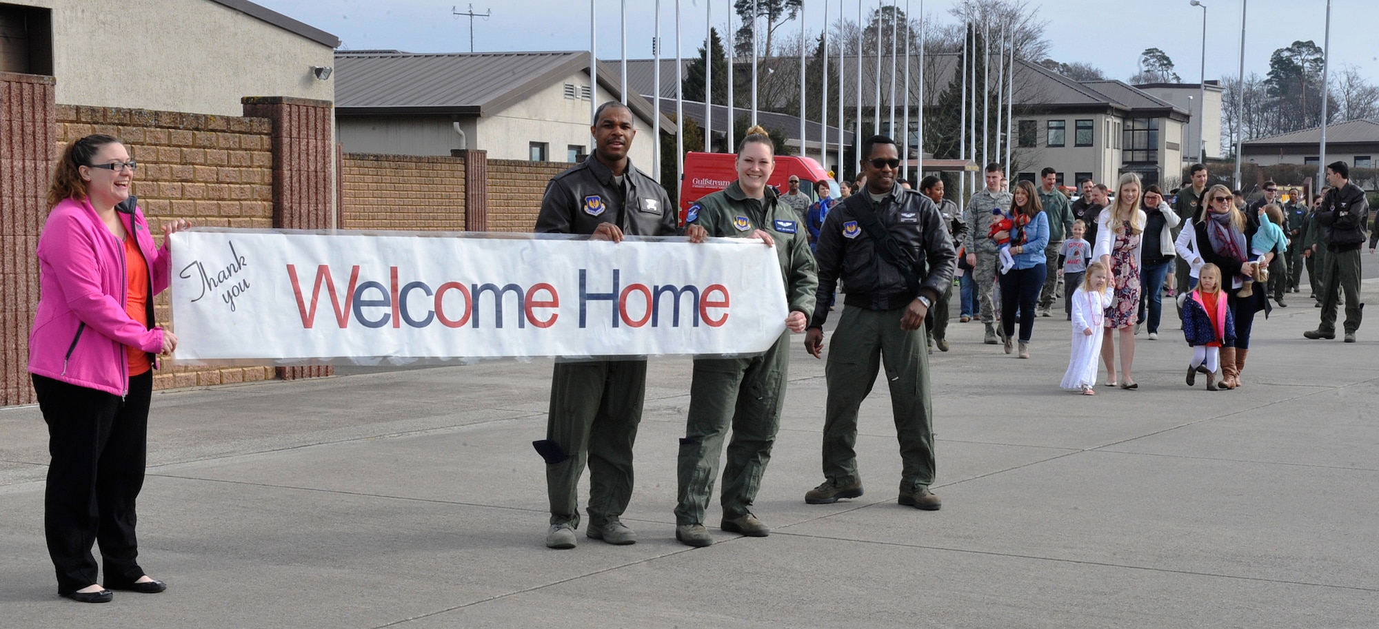 76th Airlift Squadron Airmen and family members welcome redeployers back from Afghanistan March 15, 2016, at Ramstein Air Base, Germany. Ten Airmen from the 76th AS were deployed for 2 1/2 months. (U.S. Air Force photo/Airman 1st Class Larissa Greatwood)