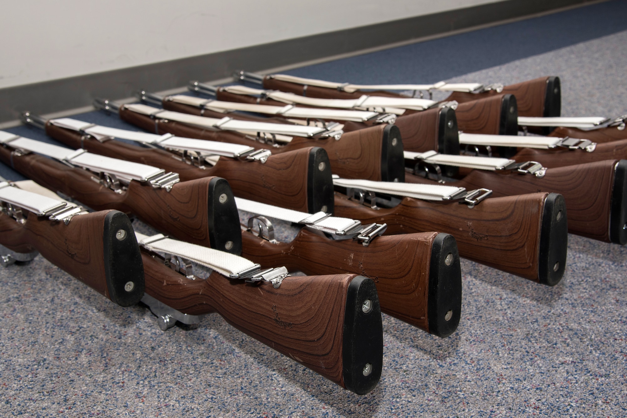 PETERSON AIR FORCE BASE, Colo. – The High Frontier Honor Guard firing party M-14s are displayed at building 1465 here in preparation for a demonstration for Col. Douglas Schiess, 21st Space Wing commander March 14, 2016. The event showcased the Honor Guard’s training, fitness, teamwork, precision and military bearing. (U.S. Air Force Photo by Craig Denton)
