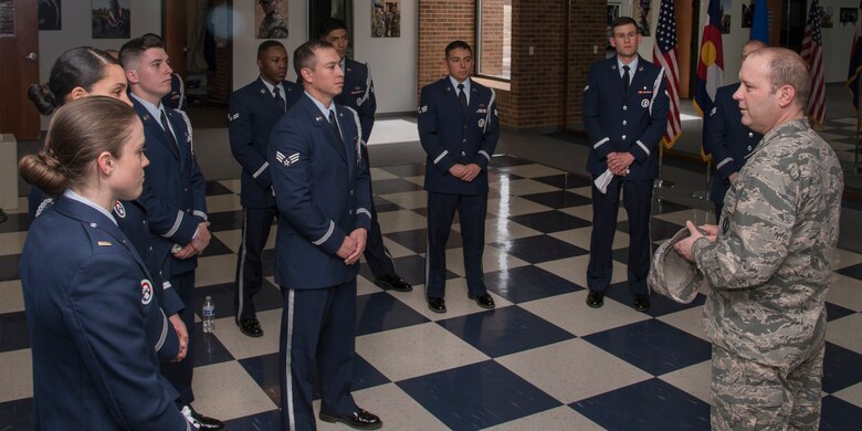 PETERSON AIR FORCE BASE, Colo. – Col. Douglas Schiess, 21st Space Wing commander thanks the High Frontier Honor Guard for a demonstration performed at building 1465 here March 14, 2016. The demonstration showcased the Honor Guard’s training, fitness, teamwork, precision and military bearing. (U.S. Air Force Photo by Craig Denton)
