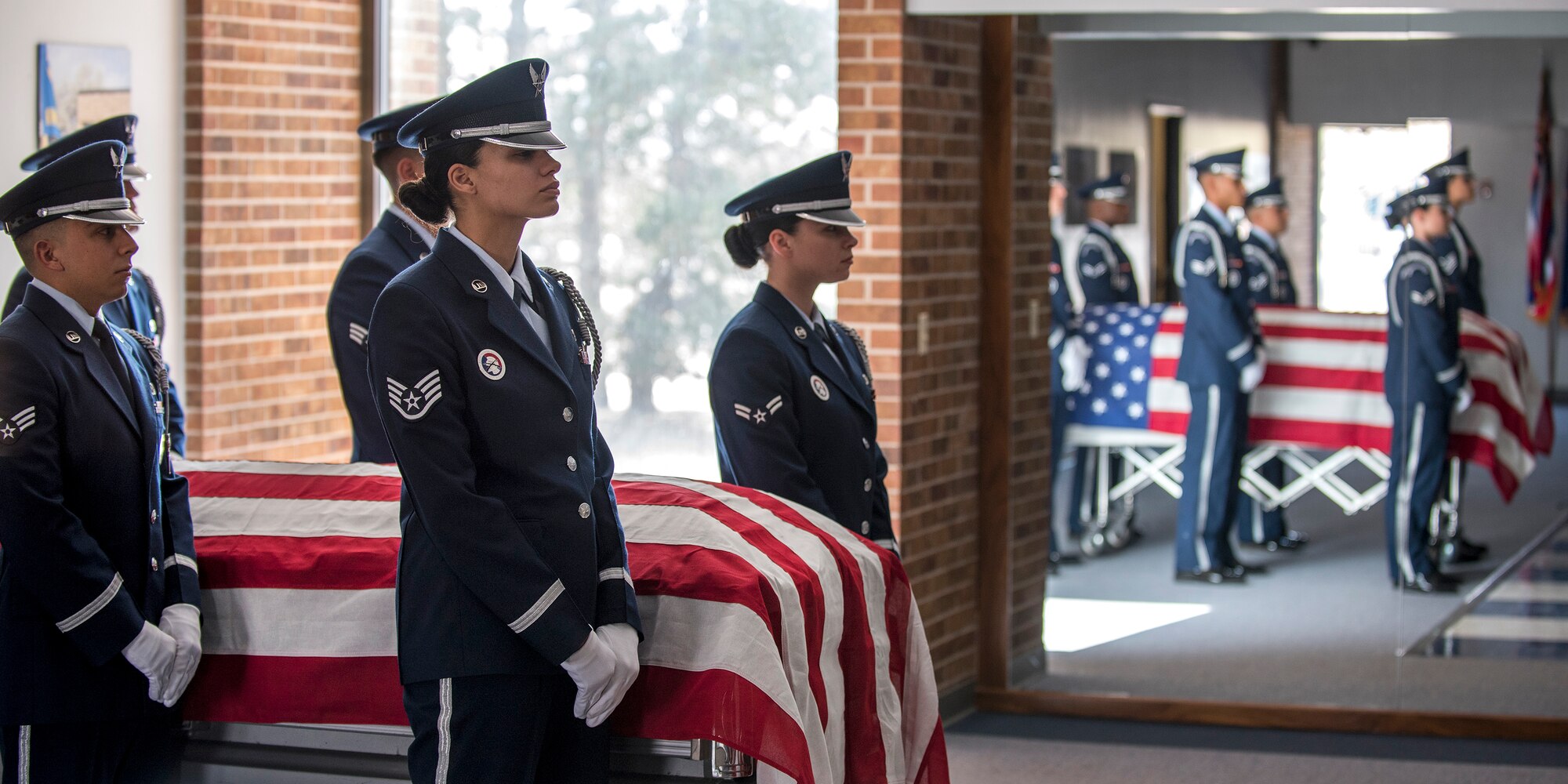 PETERSON AIR FORCE BASE, Colo. – The High Frontier Honor Guard stands ready to perform the six-person flag fold at building 1465 here in preparation for a visit from Col. Douglas Schiess, 21st Space Wing commander March 14, 2016. The demonstration showcased the Honor Guard’s training, fitness, teamwork, precision and military bearing. (U.S. Air Force Photo by Craig Denton)