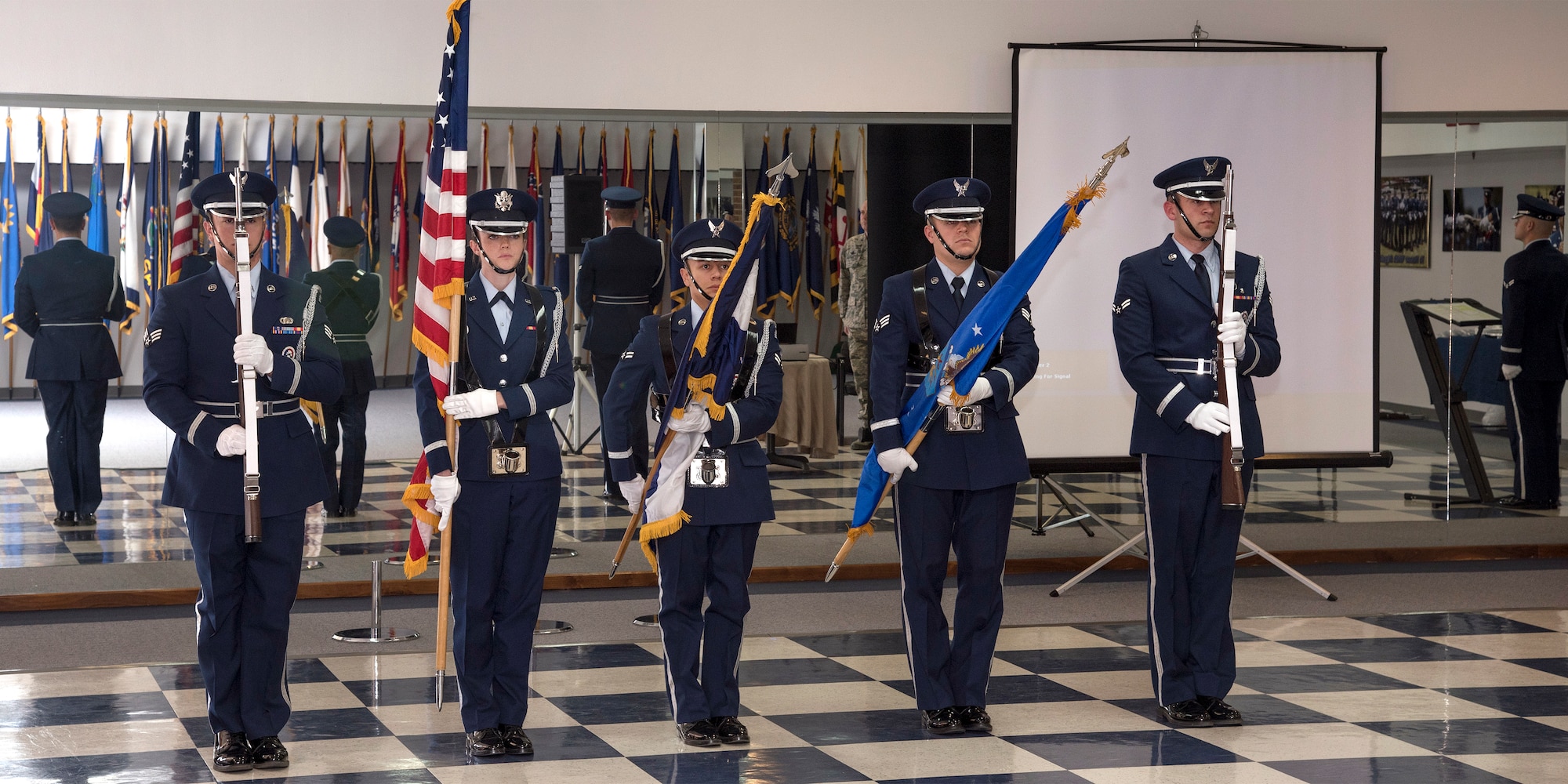 PETERSON AIR FORCE BASE, Colo. – The High Frontier Honor Guard posts the colors at a demonstration for Col. Douglas Schiess, 21st Space Wing commander at building 1465 here March 14, 2016. The demonstration provided the honor guard the opportunity to showcase their training, fitness, teamwork, precision and military bearing. (U.S. Air Force Photo by Craig Denton)