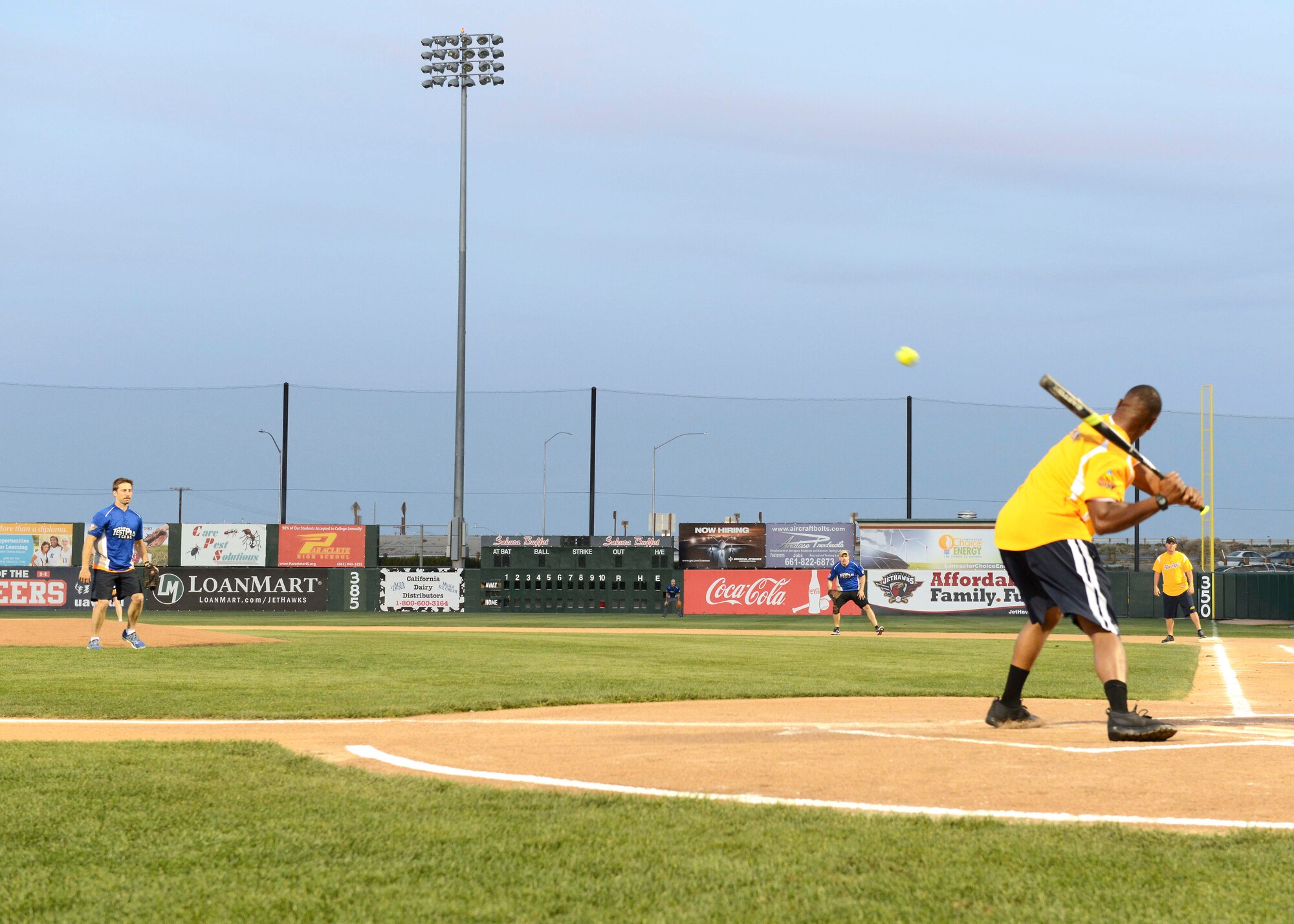 Maj. Philip Jackson, U.S. Air Force Test Pilot School Class 16A, tosses a pitch to a U.S. Navy Blue Angels batter March 18. The TPS team defeated the Blue Angels team 9-0. The game was part of a kickoff event to the 2016 L.A. County Air Show, which took place in Lancaster March 19-20. (U.S. Air Force photo by Kenji Thuloweit)