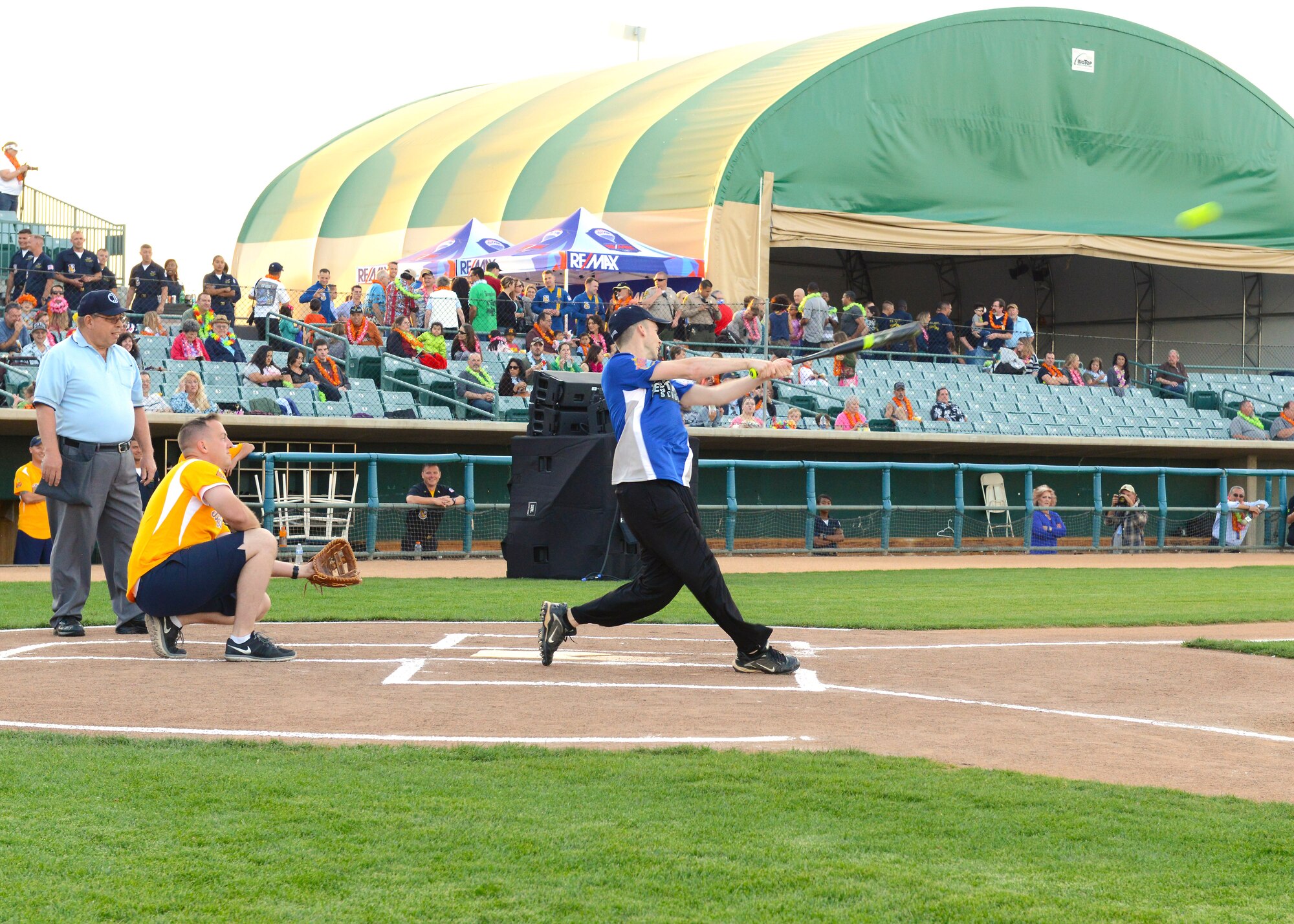 Capt. Stephen Kennedy, U.S. Air Force Test Pilot School Class 15B, connects on a pitch against the U.S. Navy Blue Angels team March 18. The TPS team defeated the Blue Angels team 9-0. The game was part of a kickoff event to the 2016 L.A. County Air Show, which took place in Lancaster March 19-20. (U.S. Air Force photo by Kenji Thuloweit)