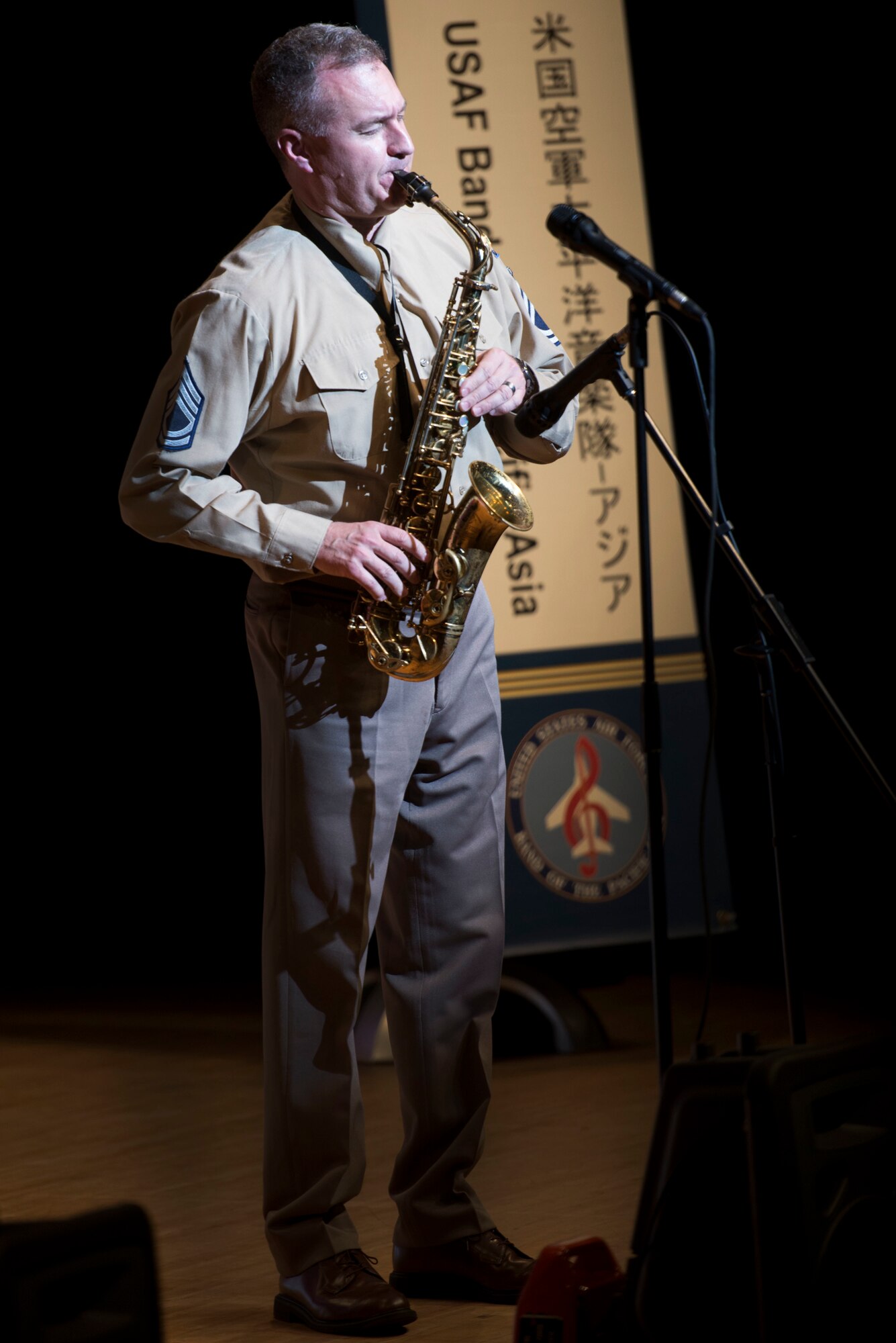 Senior Airman Joanne Griffin, U.S. Air Force Band of the Pacific-Asia vocalist, performs in Naha, Japan, March 14, 2016. The Pacific Showcase jazz ensemble performed songs in Japanese and in English. (U.S. Air Force photo by Senior Airman Omari Bernard)