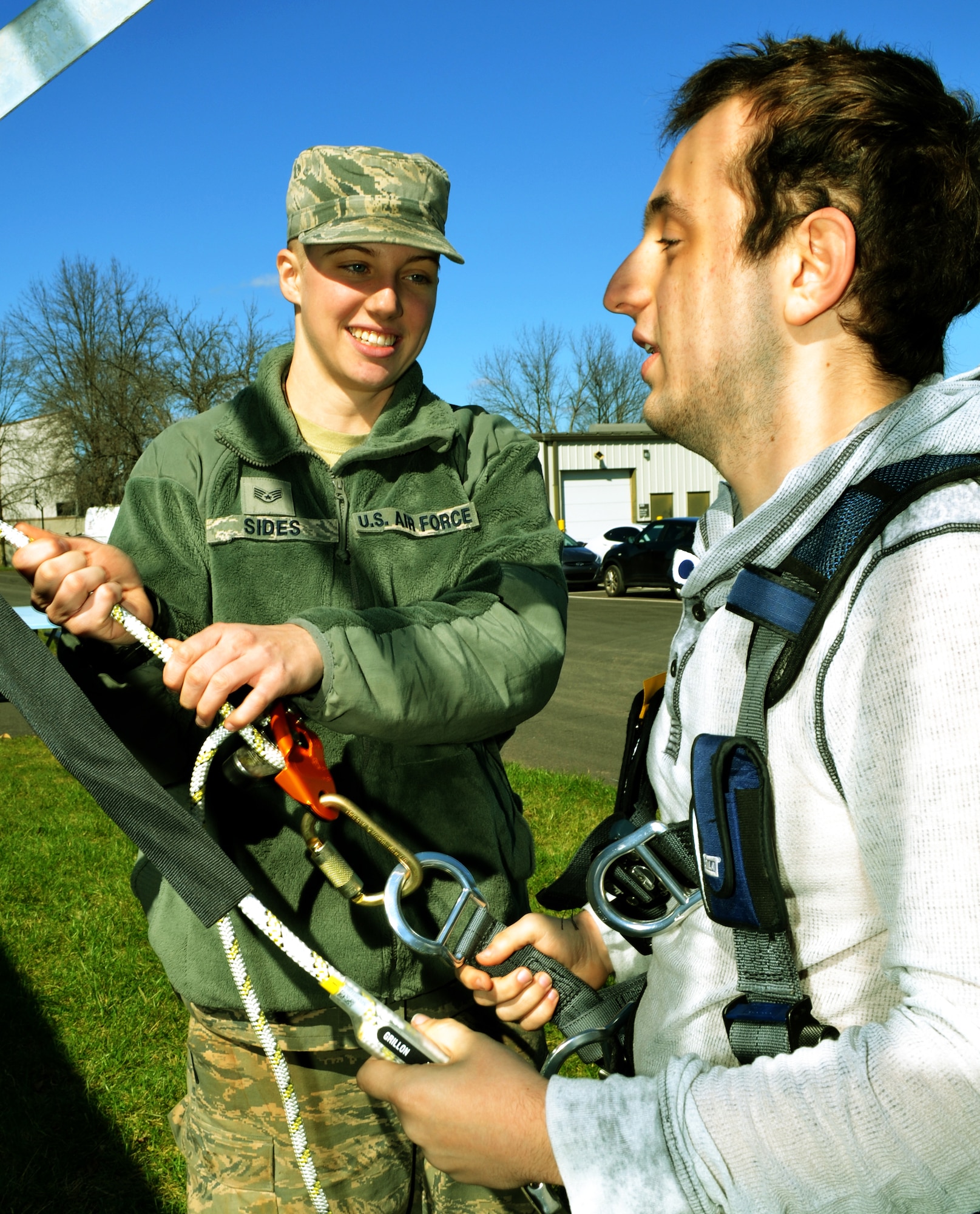 Staff Sgt. Amber Sides, a cable and antennae journeyman with the 270th Engineering Installation Squadron of the Pa. Air National Guard, helps Michael A. Davanzo III, a student in the Easton, Pa. area’s Career Institute of Technology, during tower-climbing familiarization training at Horsham Air Guard Station, Pa., March 18, 2016. Approximately 40 students took part in the tour, which illustrated some of the less familiar career fields available in the Air National Guard (U.S. Air National Guard photo by Tech. Sgt. Andria Allmond)