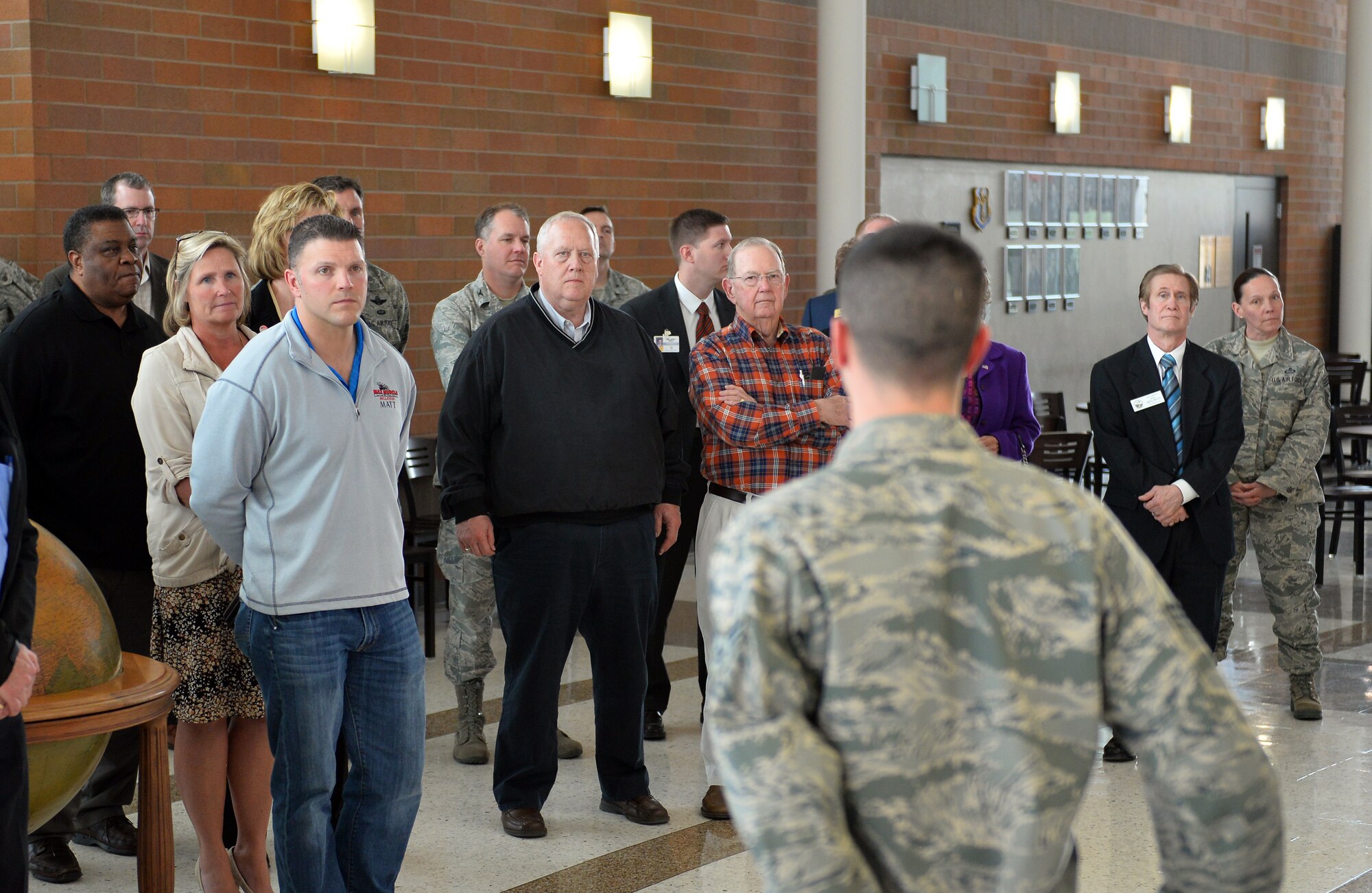 U.S. Air Force Senior Airman Jesse Brown, 16th Weather Squadron, briefs members of the Offutt Advisory Council on Air Force Weather WEB Services. AFW-WEBS is a geo-referenced and machine readable format website that forecasters use daily around the world to provide decision makers with meteorological information.(Photo by Josh Plueger)