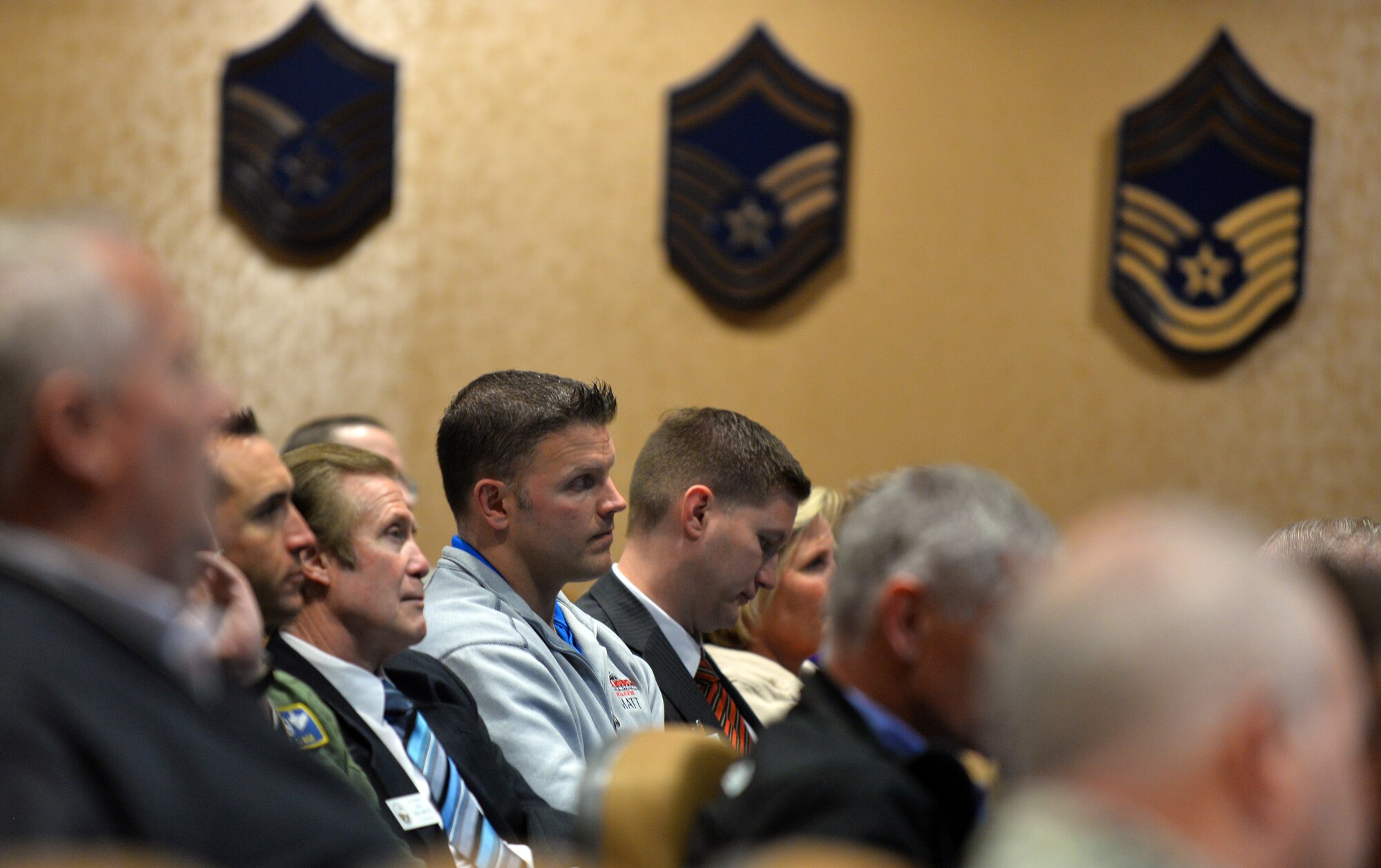 Members of the Offutt Advisory Council listen to a mission brief by U.S. Air Force Col. William Carle, 557th Weather Wing commander, during a special event March 16 at the 557th WW headquarters facility. The OAC is Offutt’s honorary commander organization whose goal is to educate the community on the mission and needs of the units on base as well as promote the morale, welfare and education of the personnel assigned to the base as well as their families.(Photo by Josh Plueger)