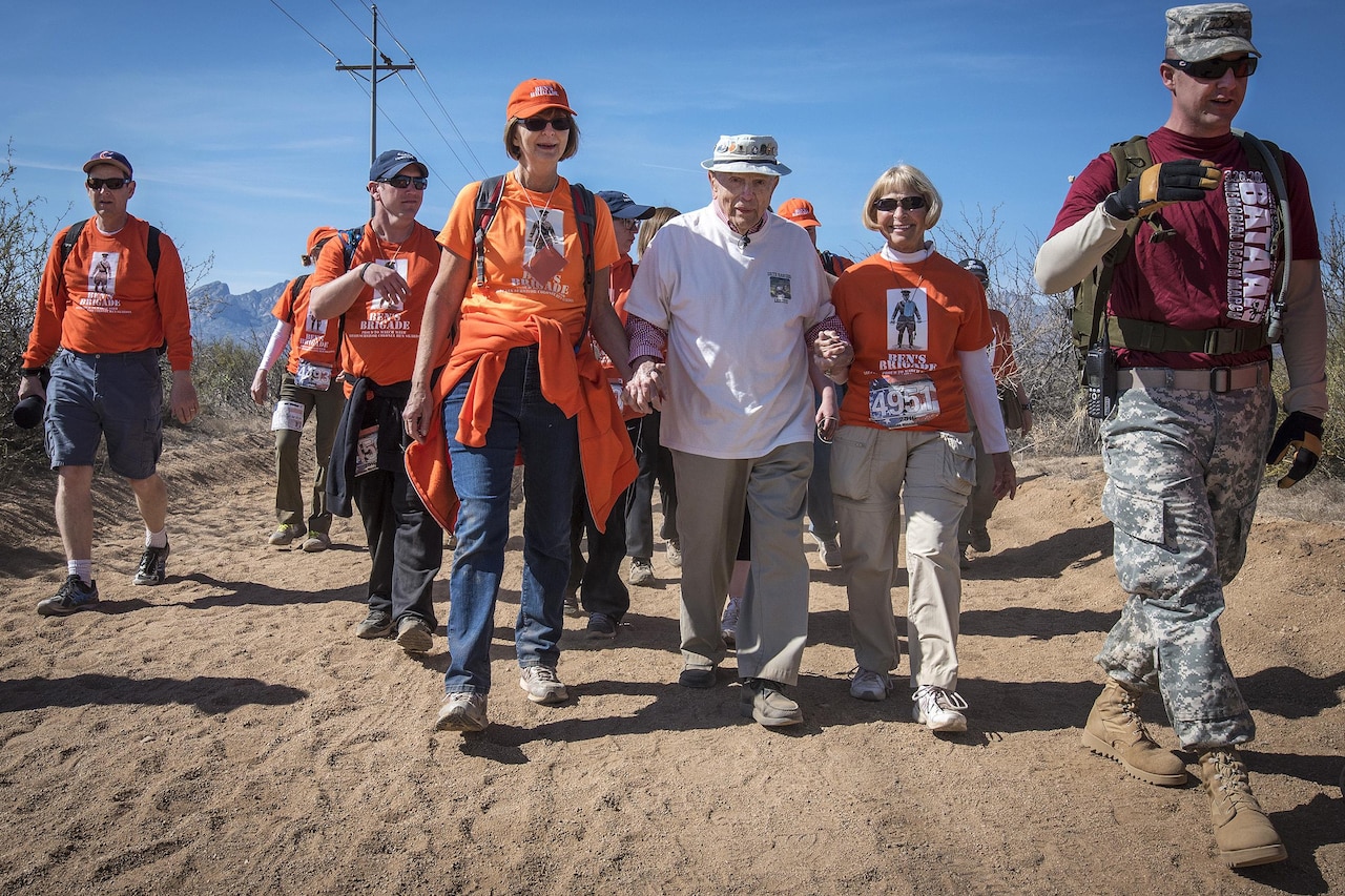 Retired Army Col. Ben Skardon, center, walks with “Ben’s Brigade,” a group of his supporters, during the Bataan Memorial Death March at White Sands Missile Range, N.M., March 20, 2016. Army photo by Staff Sgt. Ken Scar