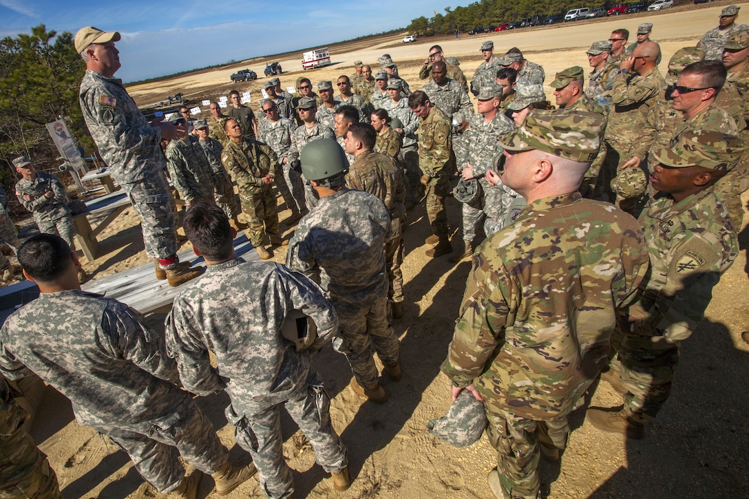 Army reservists and Air National Guardsmen receive a safety and mission brief before participating during a joint training airborne operation at Coyle drop zone at Joint Base McGuire-Dix-Lakehurst, N.J., March 12, 2016. The soldiers are assigned to the 404th Civil Affairs Battalion, 353rd Civil Affairs Command, 304th Civil Affairs Brigade and the 450th Civil Affairs Battalion. The airmen are joint tactical air control airmen assigned to the New Jersey Air National Guard's 227th Air Support Operations Squadron and the New York Air National Guard's 274th Air Support Operations Squadron. The helicopter crews are assigned to the New Jersey Army National Guard’s 1st Battalion, 150th Assault Helicopter Battalion. New Jersey Air National Guard photo by Master Sgt. Mark C. Olsen