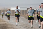 Soldiers close in on the finish line in this photo from April 18, 2010, of the run during an Army Physical Fitness Test. A new program from Guard Your Health offers do-it-yourself training and food tips.