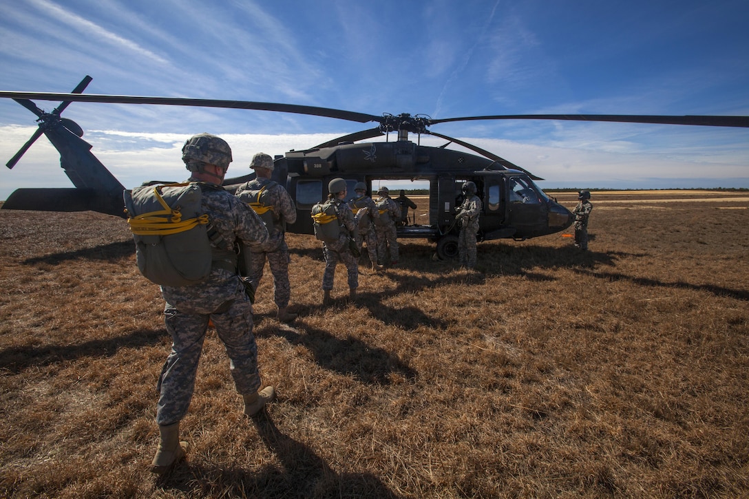 Soldiers board a UH-60 Black Hawk helicopter during a joint training airborne operation at Coyle drop zone at Joint Base McGuire-Dix-Lakehurst, N.J., March 12, 2016. New Jersey Air National Guard photo by Master Sgt. Mark C. Olsen