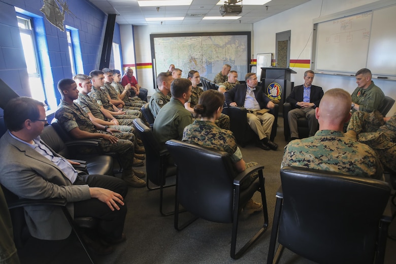 Rep. Mac Thornberry, center-right, speaks with Marines from Marine Heavy Helicopter Squadron 461 at Marine Corps Air Station New River, N.C., March 18, 2016. Thornberry met with various units at Marine Corps Air Stations Beaufort and New River, and Marine Corps Base Camp Lejeune to discuss force-related issues. (U.S. Marine Corps photo by Cpl. Lucas Hopkins/Released)