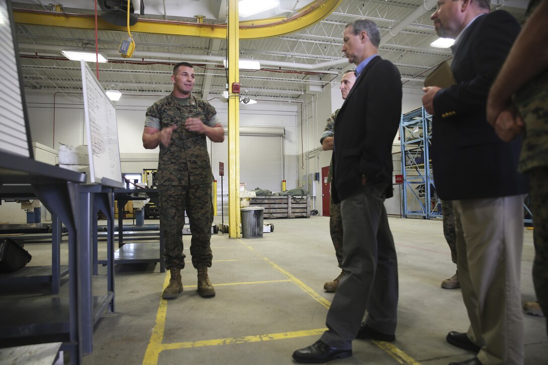 Sgt. Johnathan Sutton Jr., left, a tank mechanic with 2nd Maintenance Battalion, speaks with Rep. Mac Thornberry, right, at Marine Corps Base Camp Lejeune, N.C., March 18, 2016. Thornberry also serves as the Chairman of the House Armed Services Committee, and met with units from across II Marine Expeditionary Force to discuss force-related topics. (U.S. Marine Corps photo by Cpl. Lucas Hopkins/Released)