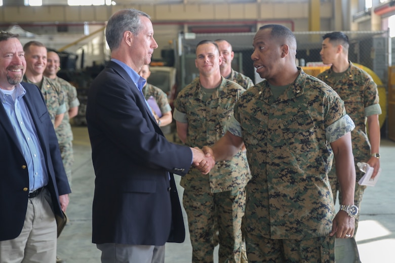 Rep. Mac Thornberry, left, shakes hands with Lt. Col. Edwin Norris, right, the commanding officer of 2nd Maintenance Battalion, at Marine Corps Base Camp Lejeune, N.C., March 18, 2016. Thornberry met with senior leaders and junior Marines throughout II Marine Expeditionary Force to discuss force-related issues. (U.S. Marine Corps photo by Cpl. Lucas Hopkins/Released)