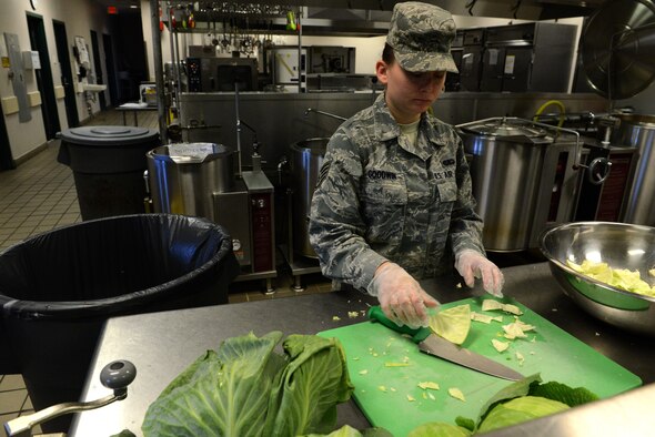 U.S. Air Force Staff Sgt. Lana Goodwin, 20th Force Support Squadron food services specialist, cuts cabbage at the Chief Master Sgt. Emerson E. Williams Dining Facility on Shaw Air Force Base, S.C., March 17, 2016. The dining facility prepares breakfast, lunch, dinner, and midnight chow for Team Shaw members seven days a week. (U.S. Air Force photo by Airman 1st Class Destinee Dougherty)