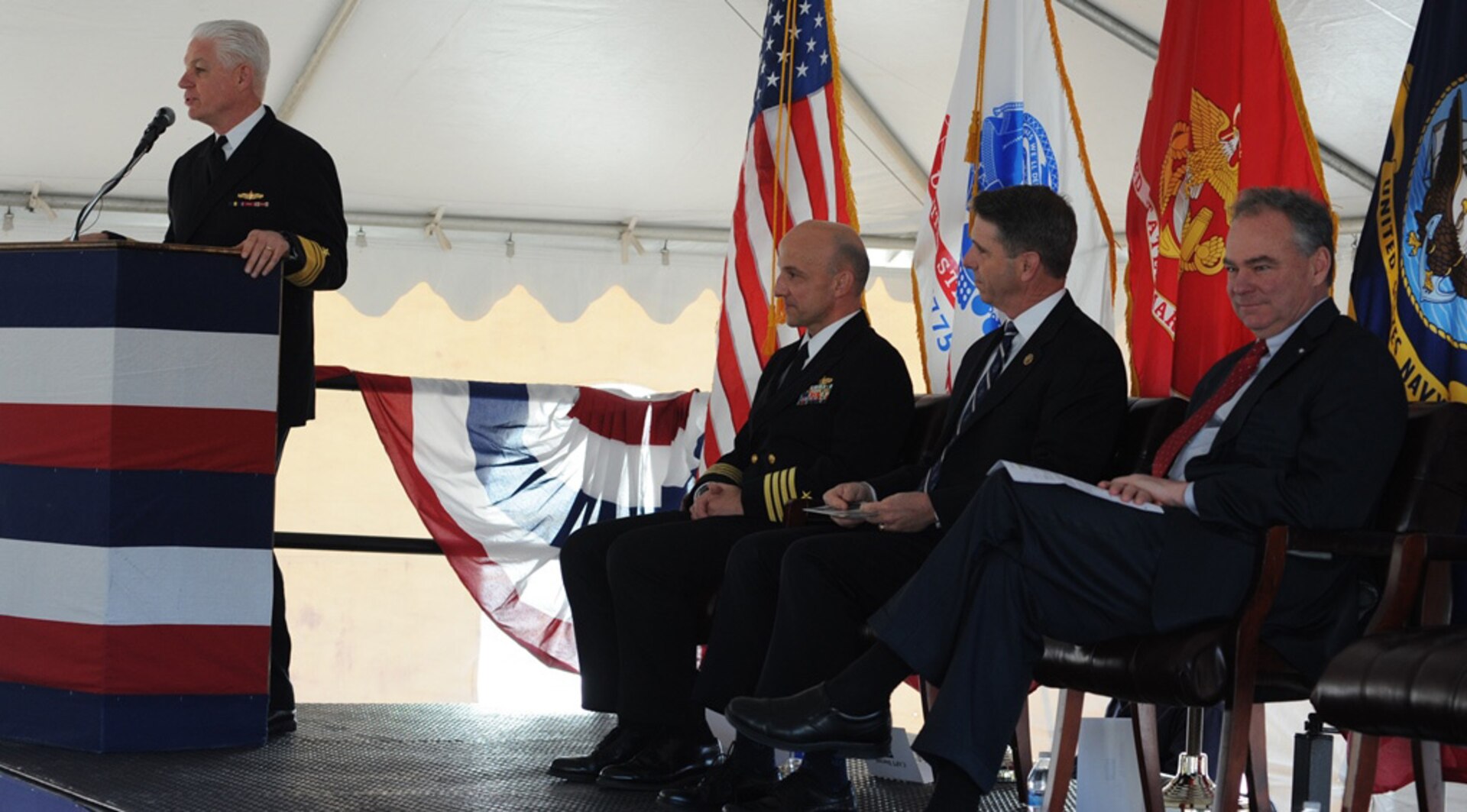 DAHLGREN, Va. - Vice Admiral Terry Benedict, Navy Strategic Systems Programs (SSP) director, tells Naval Surface Warfare Center Dahlgren Division (NSWCDD) personnel that their efforts are "absolutely critical to the defense of our country" during a ground breaking ceremony for the new Missile Support Facility, March 18. "Once completed, this $22.7 million effort, 58,000-square-foot facility is going to house the SLBM (Submarine Launched Ballistic Missile) program offices and the labs for over 300 outstanding professionals in the fields of engineering, physics, math, statistics, computer science, and the list goes on," said Benedict, the event's keynote speaker, as (left to right) NSWCDD Commanding Officer Capt. Brian Durant, Rep. Rob Wittman, R-Va., and Sen. Tim Kaine, D-Va., listen. NSWCDD has been a key member of the SLBM team since the program’s inception, and will continue throughout the next generation of submarine - the new Ohio-Replacement Program.