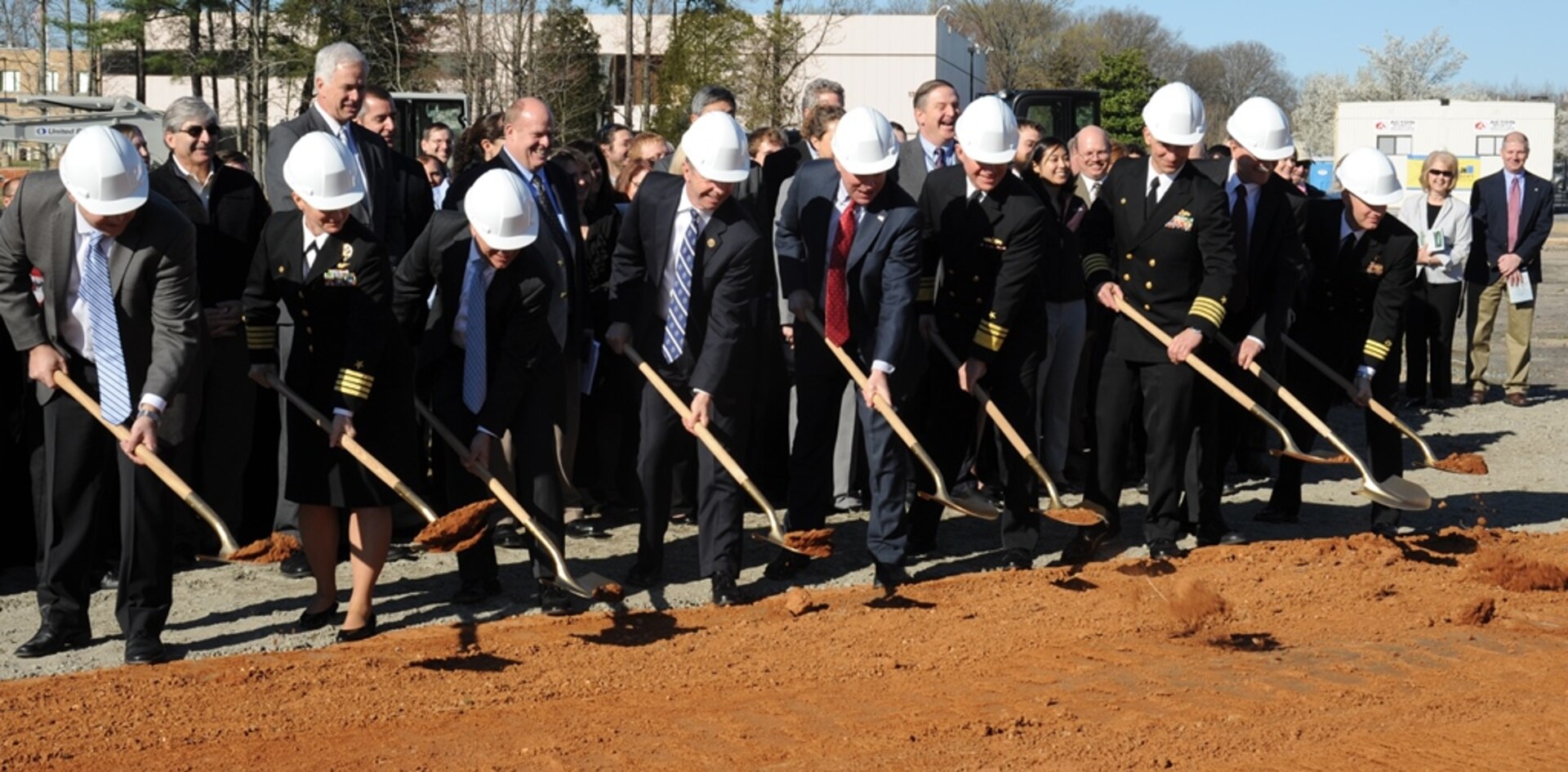 DAHLGREN, Va. - Navy leadership is joined by members of Congress at a groundbreaking ceremony for the new Naval Surface Warfare Center Dahlgren Division (NSWCDD) Missile Support Facility, March 18. The facility will feature state-of-the-art labs, offices, and equipment for more than 300 NSWCDD Strategic and Computing Systems Department scientists, engineers, and technical experts who develop, test, and maintain the Submarine Launched Ballistic Missile (SLBM) fire control and mission planning software. From left to right: Brad Hunley, construction executive for Mortenson Construction; Capt. Mary Feinberg, commanding officer for Naval Support Activity South Potomac; Dennis McLaughlin, NSWCDD technical director; Rep. Rob Wittman, R-Va.; Sen. Tim Kaine, D-Va.; Vice Adm. Terry Benedict, director of Navy Strategic Systems Programs; Capt. Brian Durant, NSWCDD commanding officer; John Fincannon, Senior Executive Service, Strategic Systems Programs; Cmdr. William Windus, Naval Facilities Engineering Command Public Works Officer.