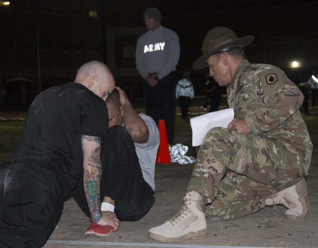 Army Reserve drill sergeant Staff Sgt. Al Napolitano, 3rd Battalion, 485th Infantry Regiment, 98th Training Division (IET), evaluates drill sergeants on the sit-up portion of the Army Physical Fitness Test (APFT) during the Drill Sergeant of the Year competition at Fort Jackson, S.C., March 22. The APFT was the first of 18 events, which the drill sergeants are tested on over a five-day period to determine the top two Soldiers who will go on to compete at the TRADOC Drill Sergeant of the Year competition later this year at Fort Jackson, S.C. (U.S. Army photo by Sgt. Brandon Rizzo/released)