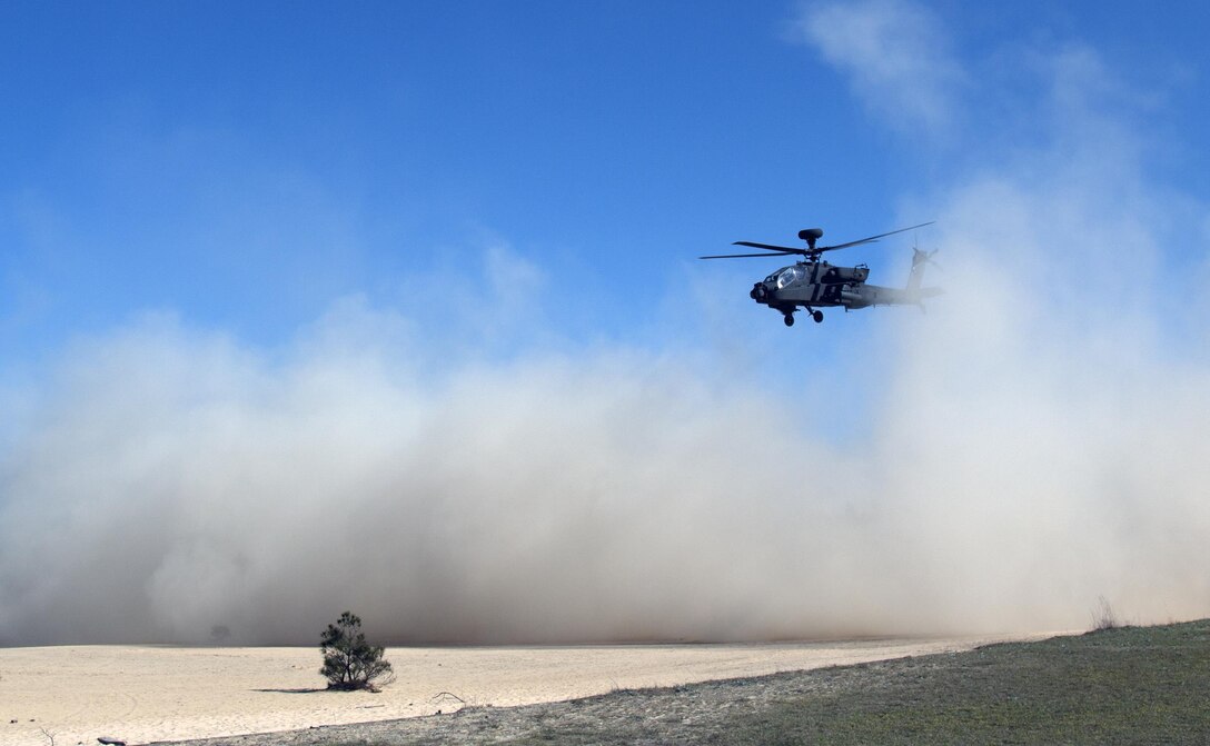 An AH-64 Apache helicopter conducts "touch-and-go" exercises in a simulated desert landing zone at Fort Jackson, S.C.