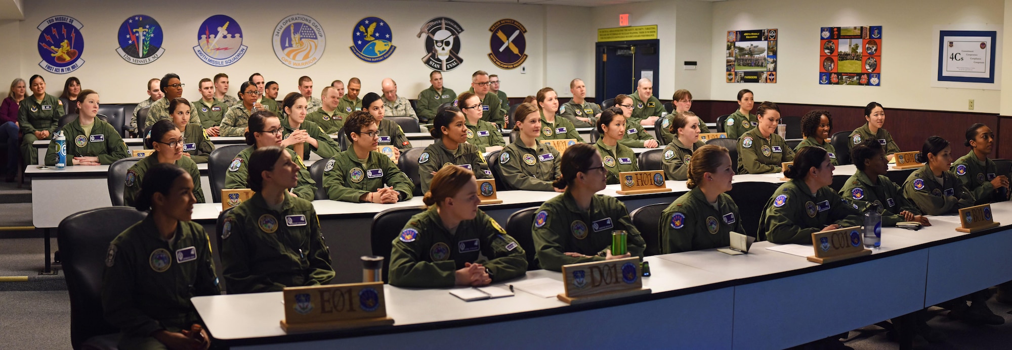 All women missileer crews from Malmstrom Air Force Base, Mont., gather for a pre departure briefing before heading in the 13,800 square mile missile complex to complete their 24-hour alert March, 22, 2016. On March 22nd, all of the nation’s alert intercontinental ballistic missile missileers and B-52 Stratofortress crews within the United States will be crewed by women as part of Air Force Global Strike Command’s recognition of Women’s History Month. (U.S. Air Force photo/Airman Collin Schmidt)