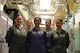 Missileers from Malmstrom Air Force Base, Mont., pose for a photograph after a training session at the missile procedures trainer March 21, 2016. Missile officers perform extensive training to ensure their ability to maintain quick response time and accurate input of essential data. (U.S. Air Force photo/Airman Collin Schmidt)