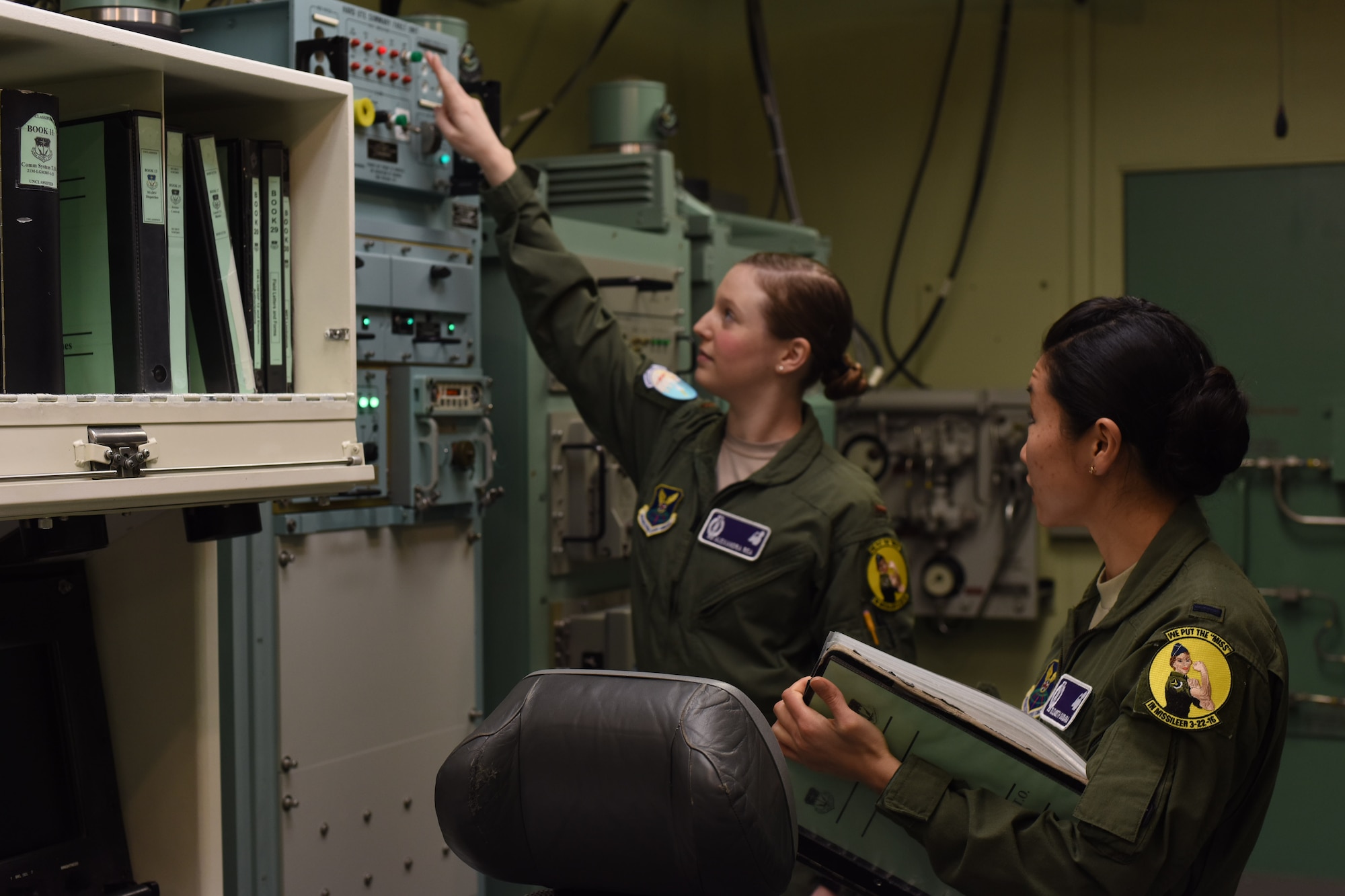 2nd Lt. Alexandra Rea, 490th Missile Squadron ICBM combat crew deputy director, left, and 1st Lt. Elizabeth Guidara, 12th Missile Squadron combat crew deputy director, perform training at the Malmstrom Air Force Base, Mont. Building 500 Missile Procedures Trainer March, 21, 2016. During their assignment, the all-female crews of missileers will maintain a 24-hour alert shift to sustain an active alert status of our nation’s intercontinental ballistic missile force. (U.S. Air Force photo/Airman Collin Schmidt)