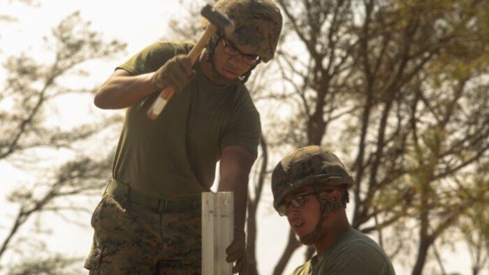 U.S. Marines with Marine Wing Support Squadron 272 drive stakes into the ground around the perimeter of a vertical take-off and landing pad during a Marine Corps Combat Readiness Evaluation at Marine Corps Auxiliary Landing Field Bogue, North Carolina, March 17, 2016. The MCCRE, which went from March 14-18, tested MWSS-272’s ability to build an AM-2 aluminum matting V/TOL pad ready to accept incoming aircraft. MWSS-272 is part of Marine Aircraft Group 26, 2nd Marine Aircraft Wing. 