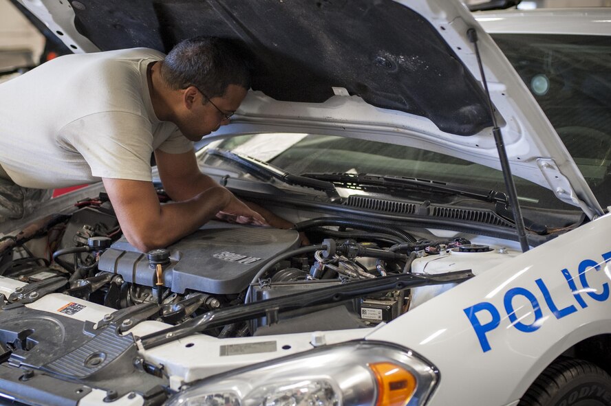 U.S. Air Force Staff Sgt. Phillip Robinson, 23d Logistics Readiness Squadron vehicle maintenance journeyman, inspects the engine of a 23d Security Forces Squadron vehicle, March 22, 2016, at Moody Air Force Base, Ga. The 23d LRS vehicle management flight maintains approximately 440 special duty vehicles for base support. (U.S. Air Force photo by Airman 1st Class Lauren M. Johnson/Released)