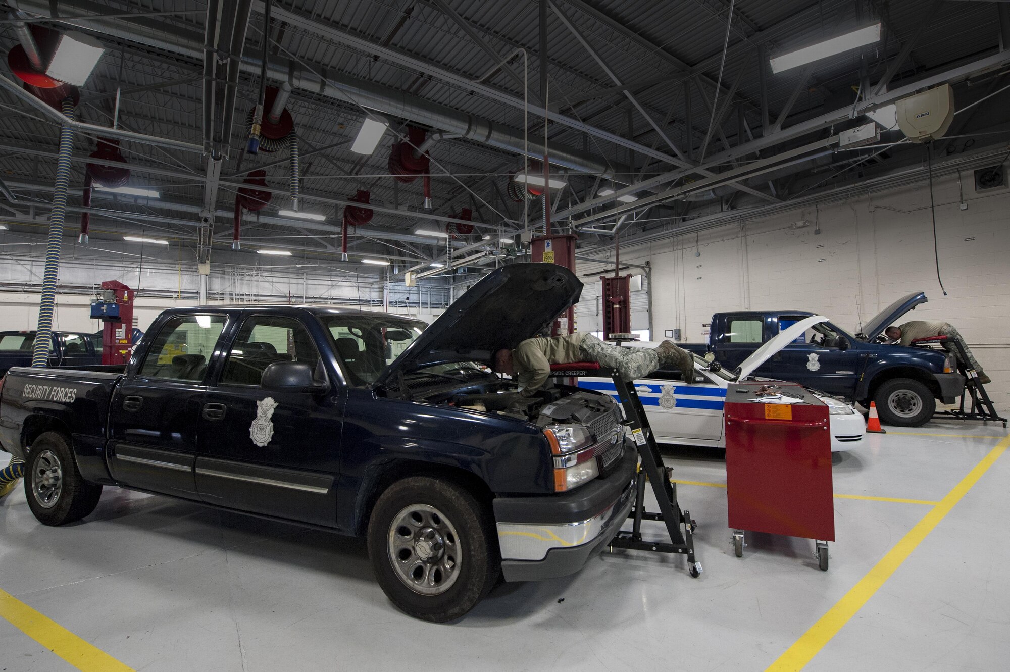 U.S. Air Force Airmen from the 23d Logistics Readiness Squadron’s vehicle maintenance flight repair government operated vehicles, March 22, 2016, at Moody Air Force Base, Ga. The vehicle management flight maintains and services all of Moody’s general purpose transportation as well as fire protection vehicles, cargo loaders, forklifts, aircraft refueling vehicles, flightline support and civil engineering heavy equipment.
(U.S. Air Force photo by Airman 1st Class Lauren M. Johnson/Released)
